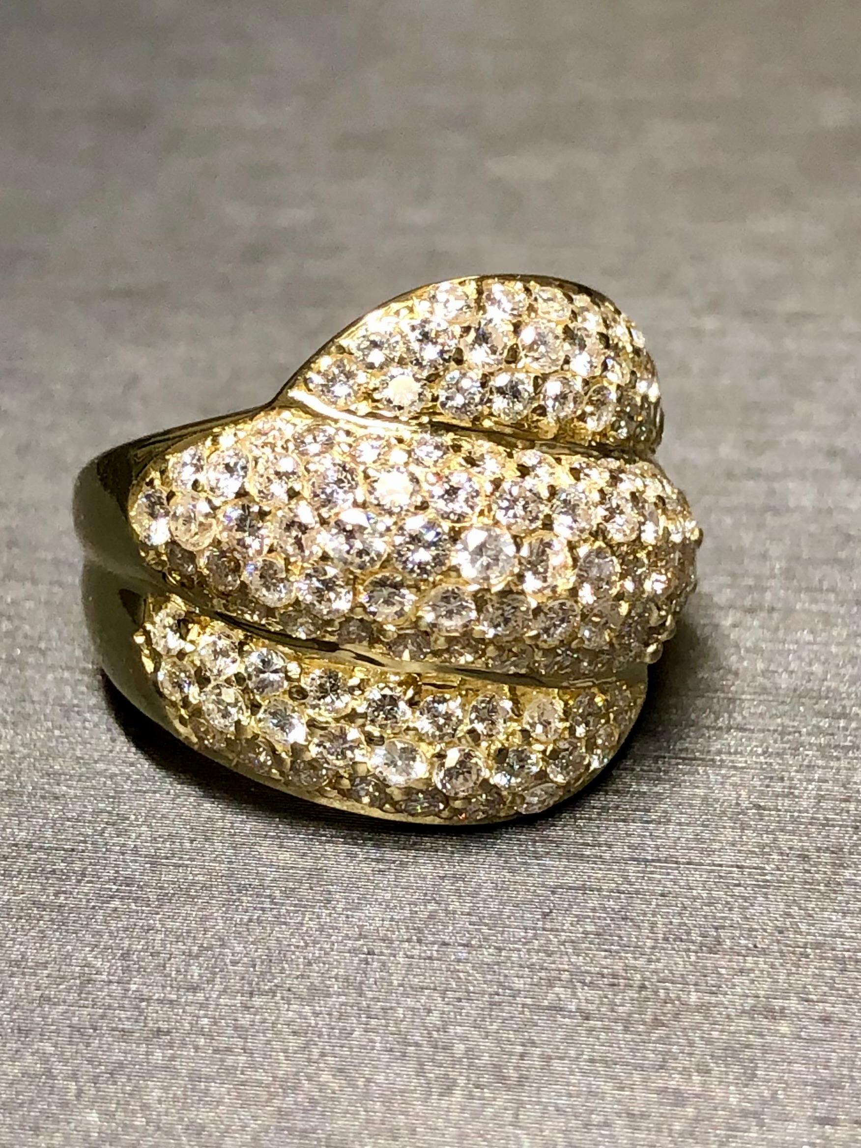 An elegant cocktail ring crafted in 18K yellow gold and pavé set with approximately 2.70cttw in G-I color Vs2-Si1 clarity round diamonds. Beautifully set diamonds creating all of the sparkle that one could want!


Dimensions/Weight:

Ring measures