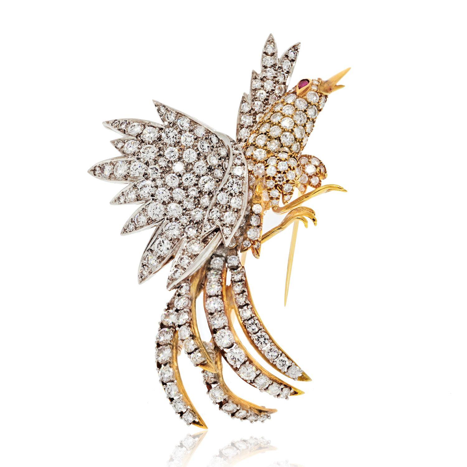 The estate diamond bird brooch is an extraordinary piece of jewelry that captures the essence of grace and elegance. Crafted with meticulous artistry, this brooch showcases a stunning depiction of a bird on the verge of taking flight. The entire