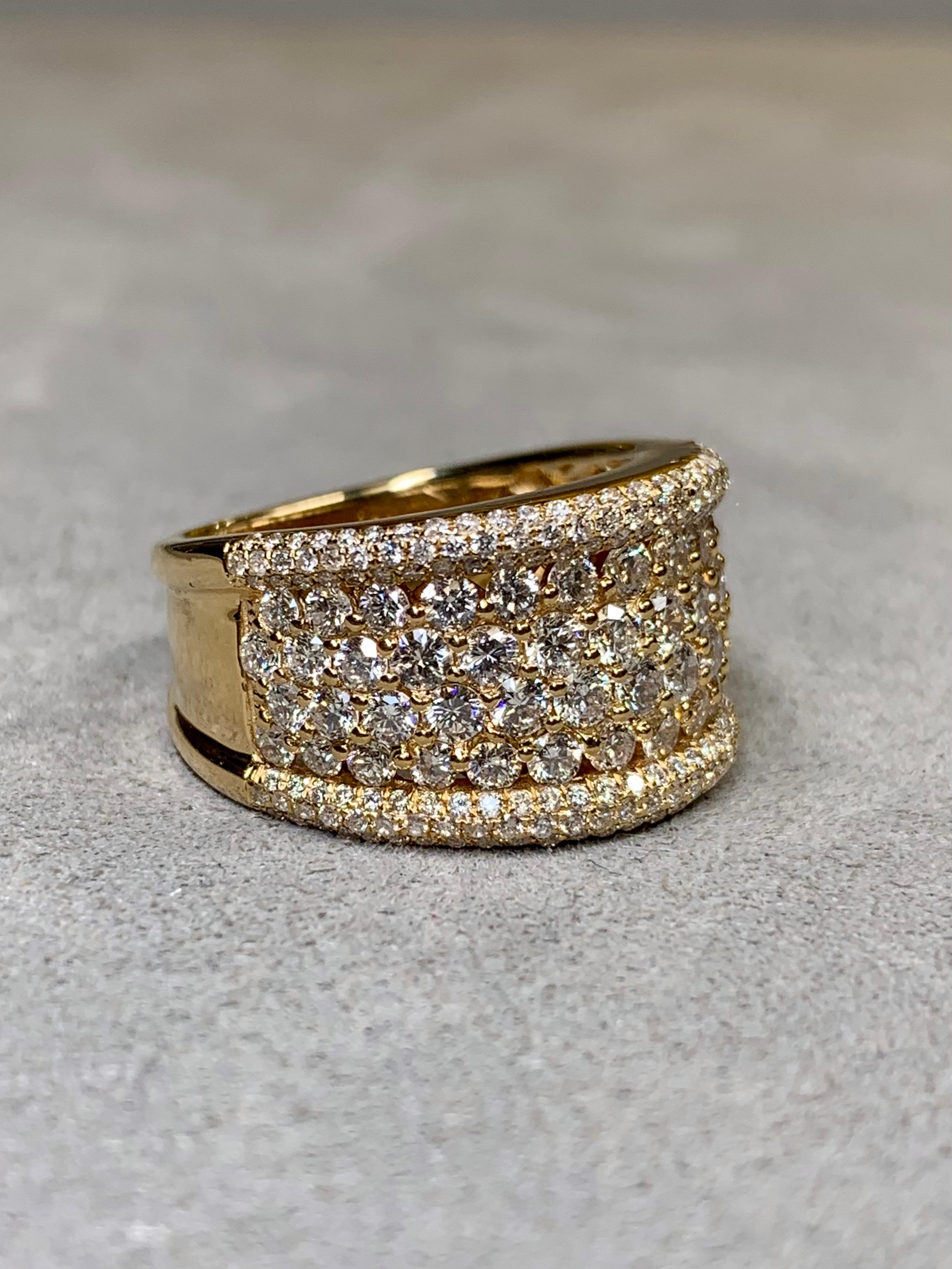 An absolutely stunning cocktail ring done in 18K yellow gold and both prong and pavé set with exquisitely matching bright, brilliant round diamonds. All stones are F-H in color and Vs1-Si1 in clarity.


Dimensions/Weight:

Ring measures .50” top to