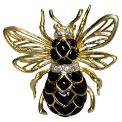 Spilla d'epoca in oro giallo ROBERT WANDER WINC con diamante e onice lucidata