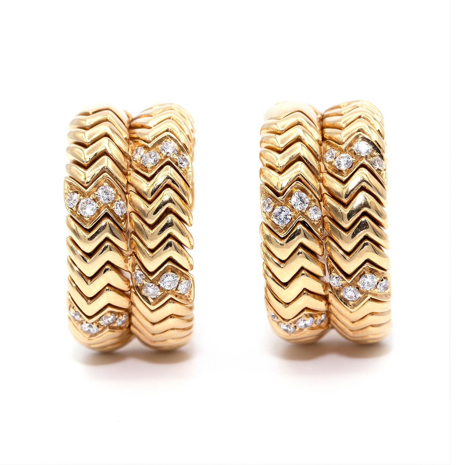 Spiga hoop earrings from Estate BVLGARI. Polished 18-karat yellow gold hardware. Zigzag hoops with round-brilliant cut diamonds. 0.40 total diamond carat weight. Lever backs for pierced or not ears. Made in Italy. Signed Bvlgari and numbered.
Every