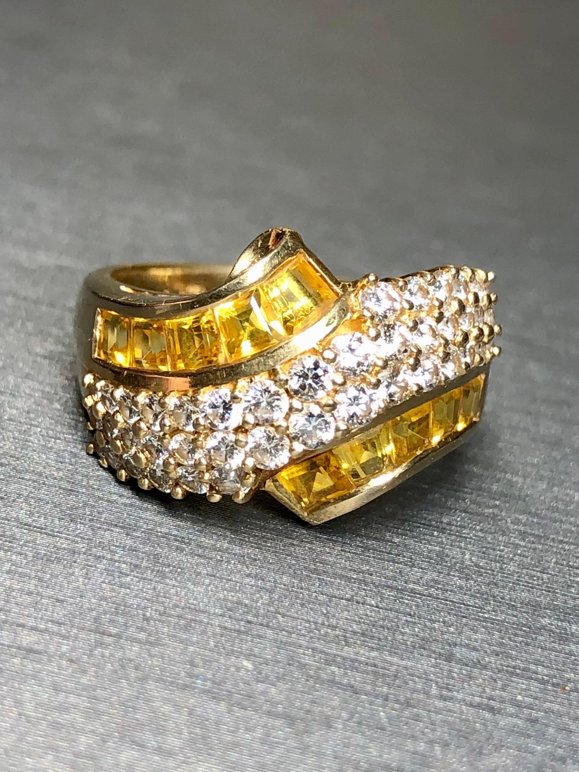 A nicely made cocktail ring crafted in 18K yellow gold and channel set with approximately 1.90cttw in natural yellow square baguette cut sapphires as well as 1cttw in G-I color Vs1-2 clarity diamonds.


Dimensions/Weight:

Ring measures .60” wide