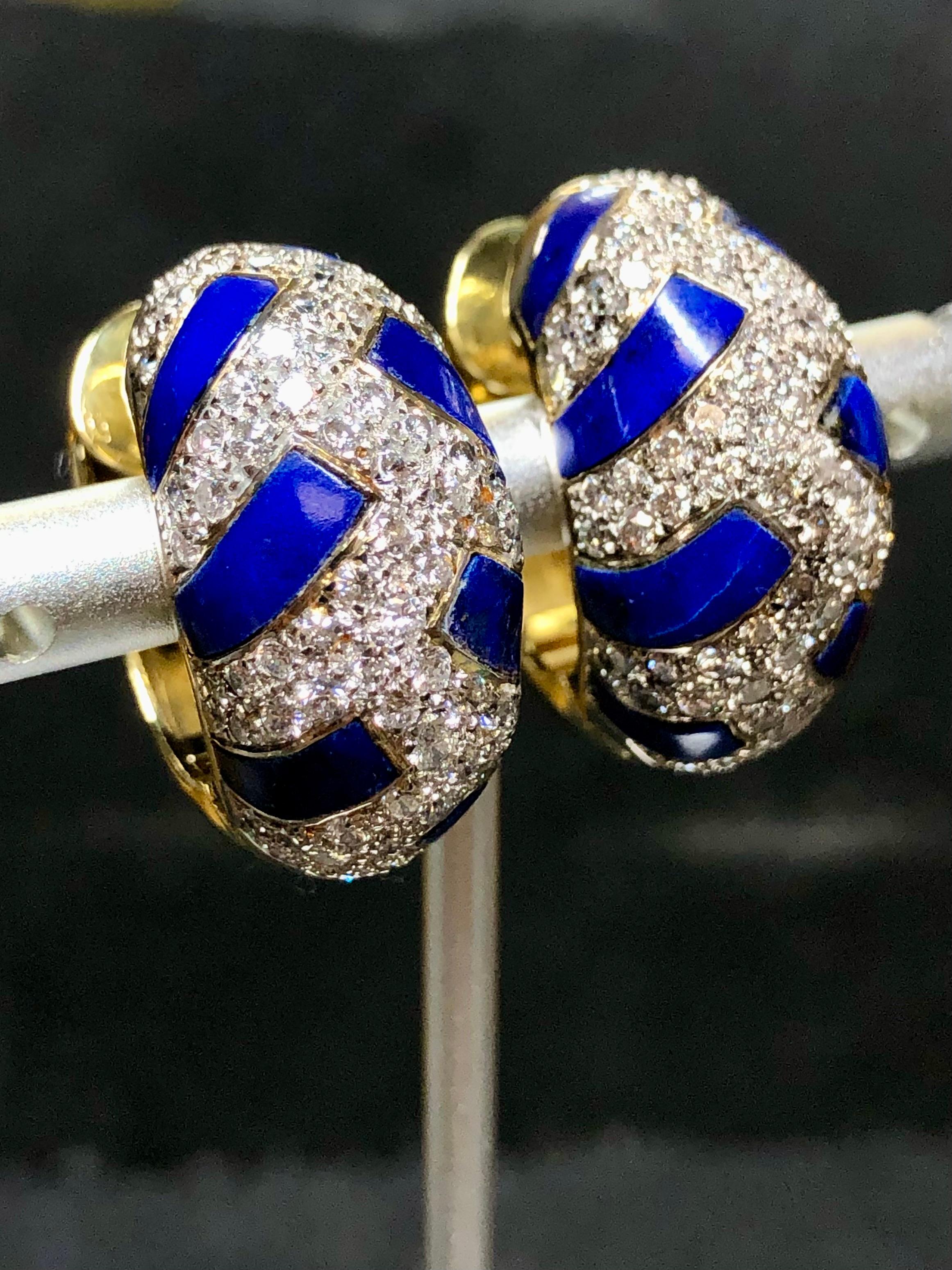 A gorgeous pair of nicely made huggie earrings crafted in 18K yellow and white gold and set with approximately 3.15cttw in round cut H-I color Vs2-Si2 clarity round diamonds and finished with natural lapis inlay.


Dimensions/Weight:

Earrings