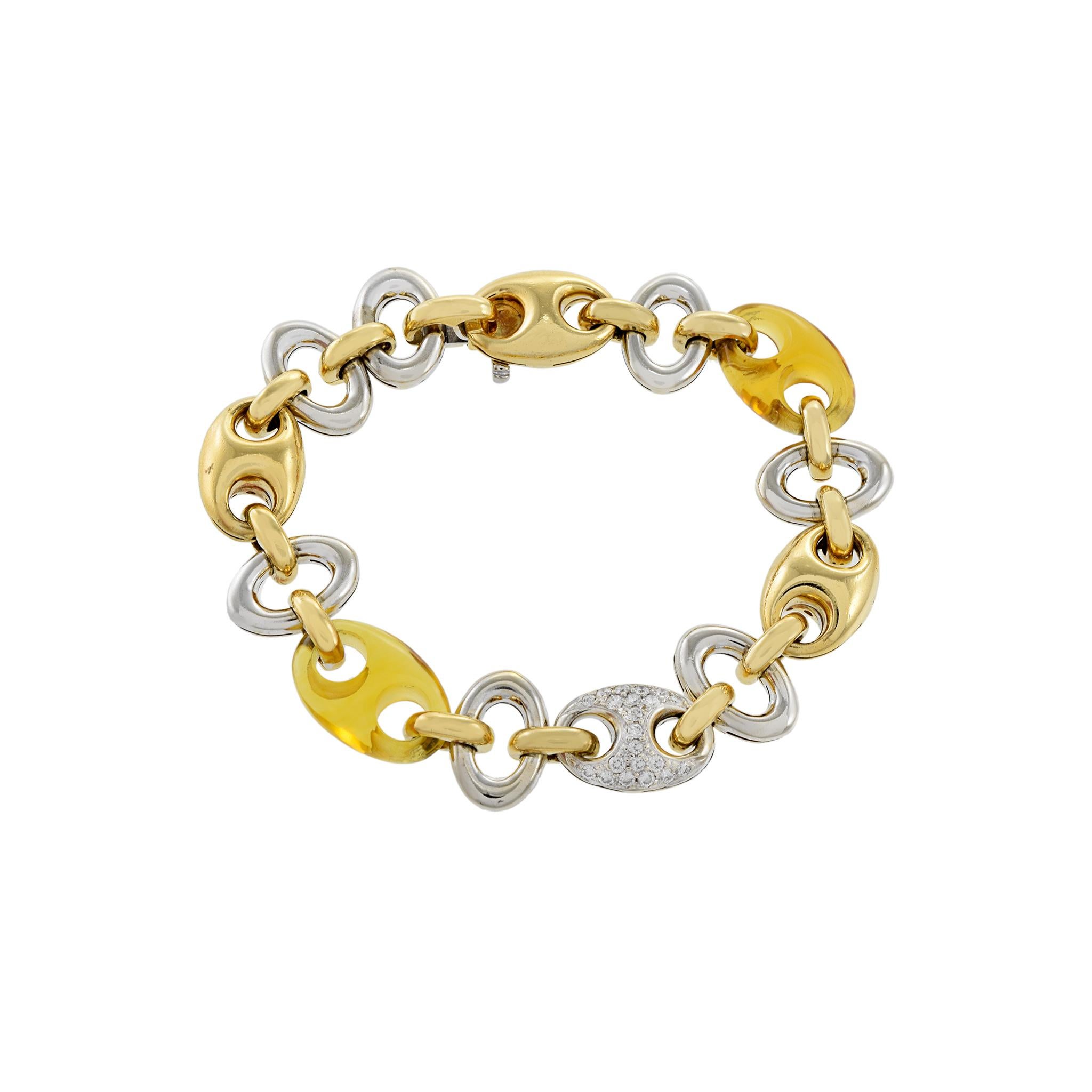 Discover the luxurious quality and elegance of estate 18KT two tone gold heavy link bracelet. Created with natural amber and 0.50CT-TW of diamonds, this bracelet is sure to add a touch of sophistication to any outfit. With its heavy link design, it