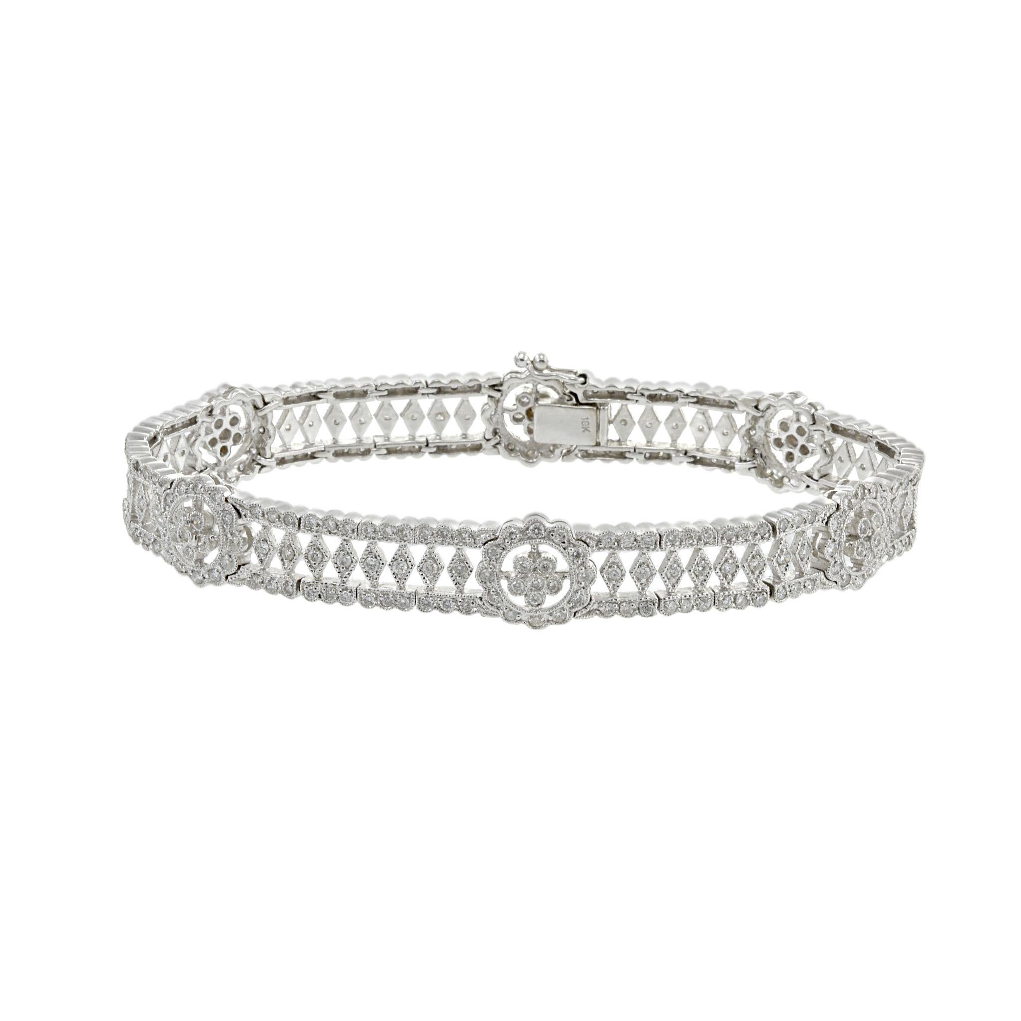 Experience the epitome of luxury with this stunning estate 18KT white gold fancy flower filigree diamond bracelet. Featuring 2.90CT-TW of G-I VS SI round brilliant cut diamonds, this exclusive piece exudes timeless elegance and impeccable