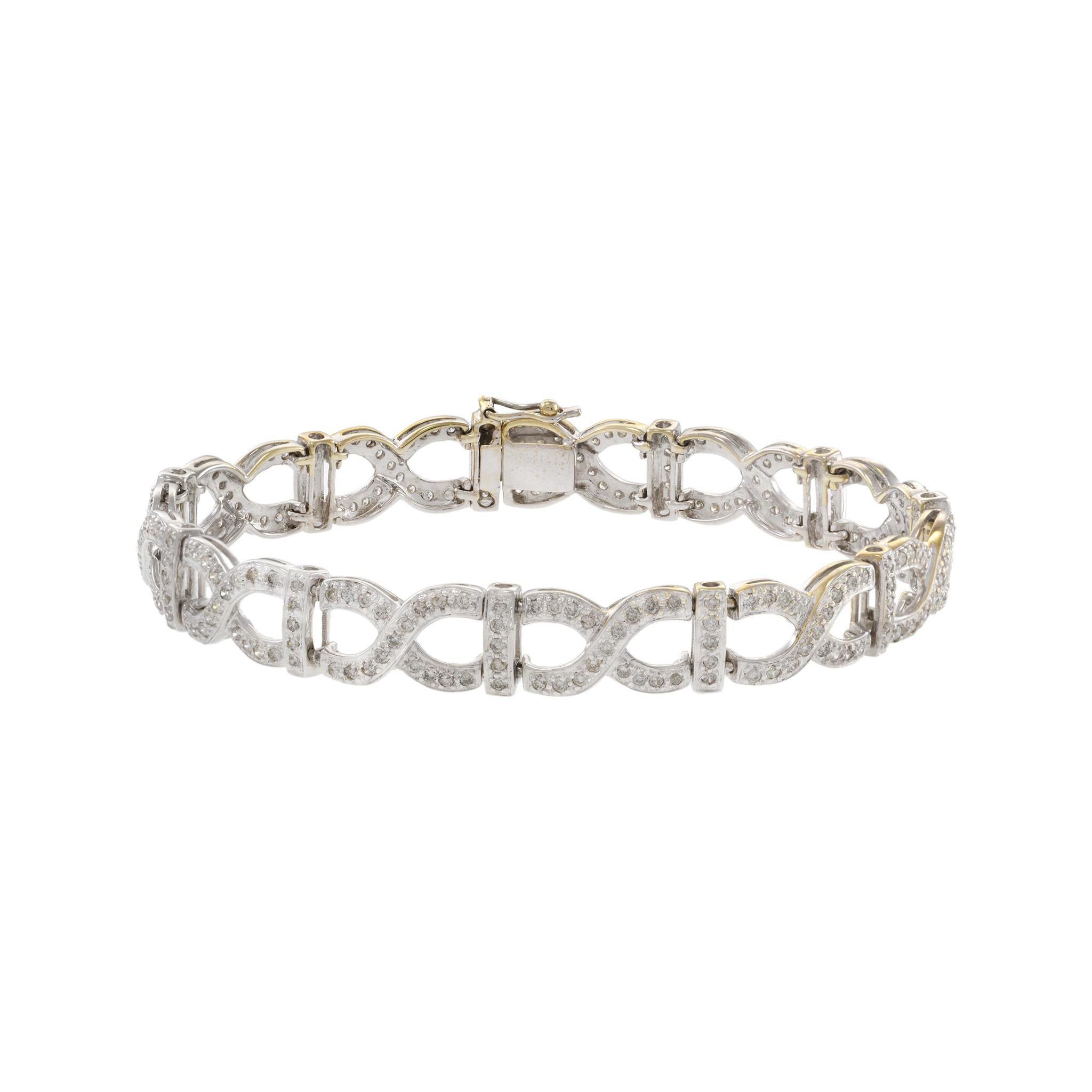 This estate 18KT white gold X link bracelet boasts an impressive 2.52CT-TW of sparkling diamonds, making it a luxurious and eye-catching accessory. Crafted with high-quality materials, it is a timeless investment piece that will elevate any outfit.