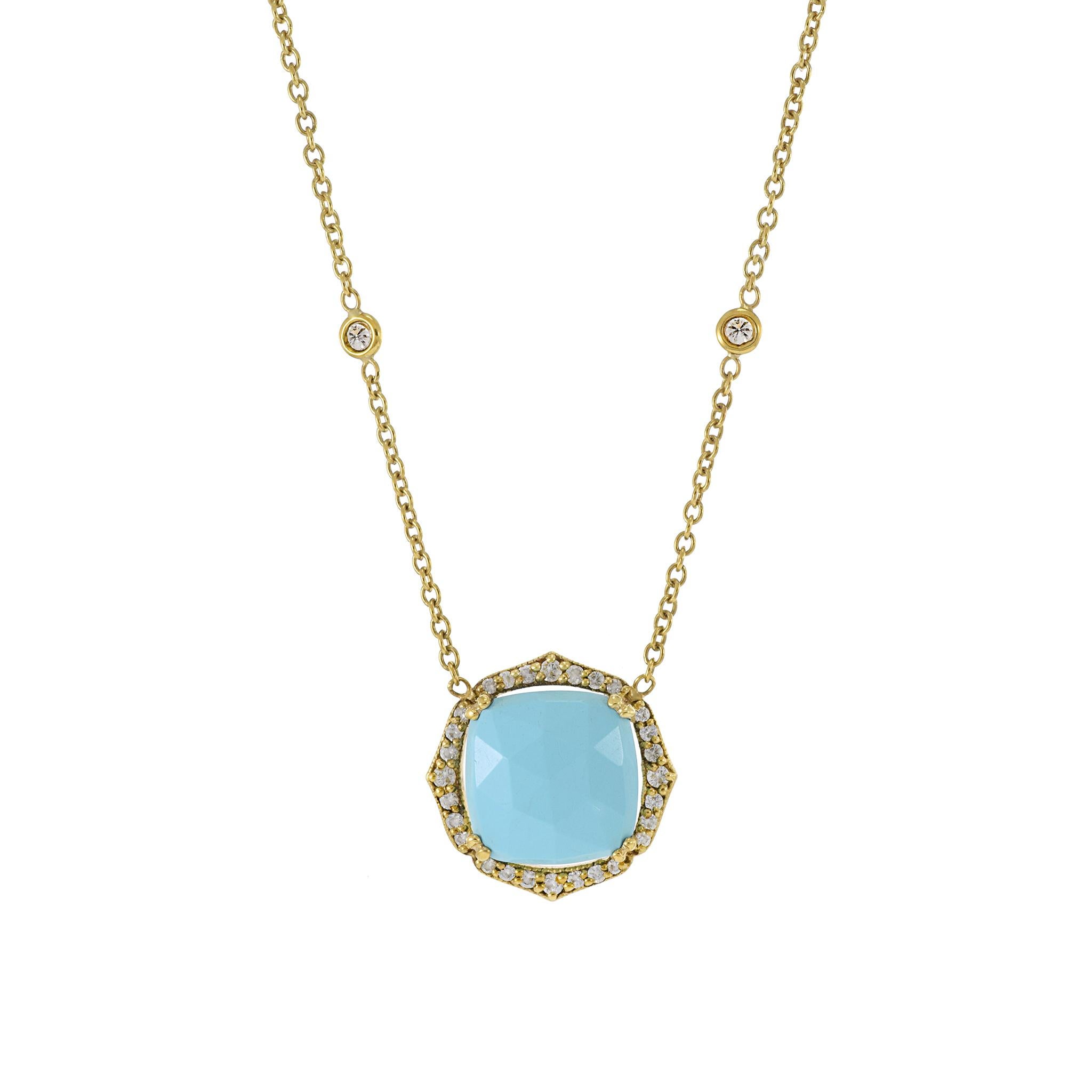 The estate-signed Penny Preveil turquoise and diamond necklace. This exquisite piece features a single, beautifully faceted turquoise gemstone as its centerpiece, encircled by a halo of 0.30 carat total weight of round-cut diamonds. Length 16