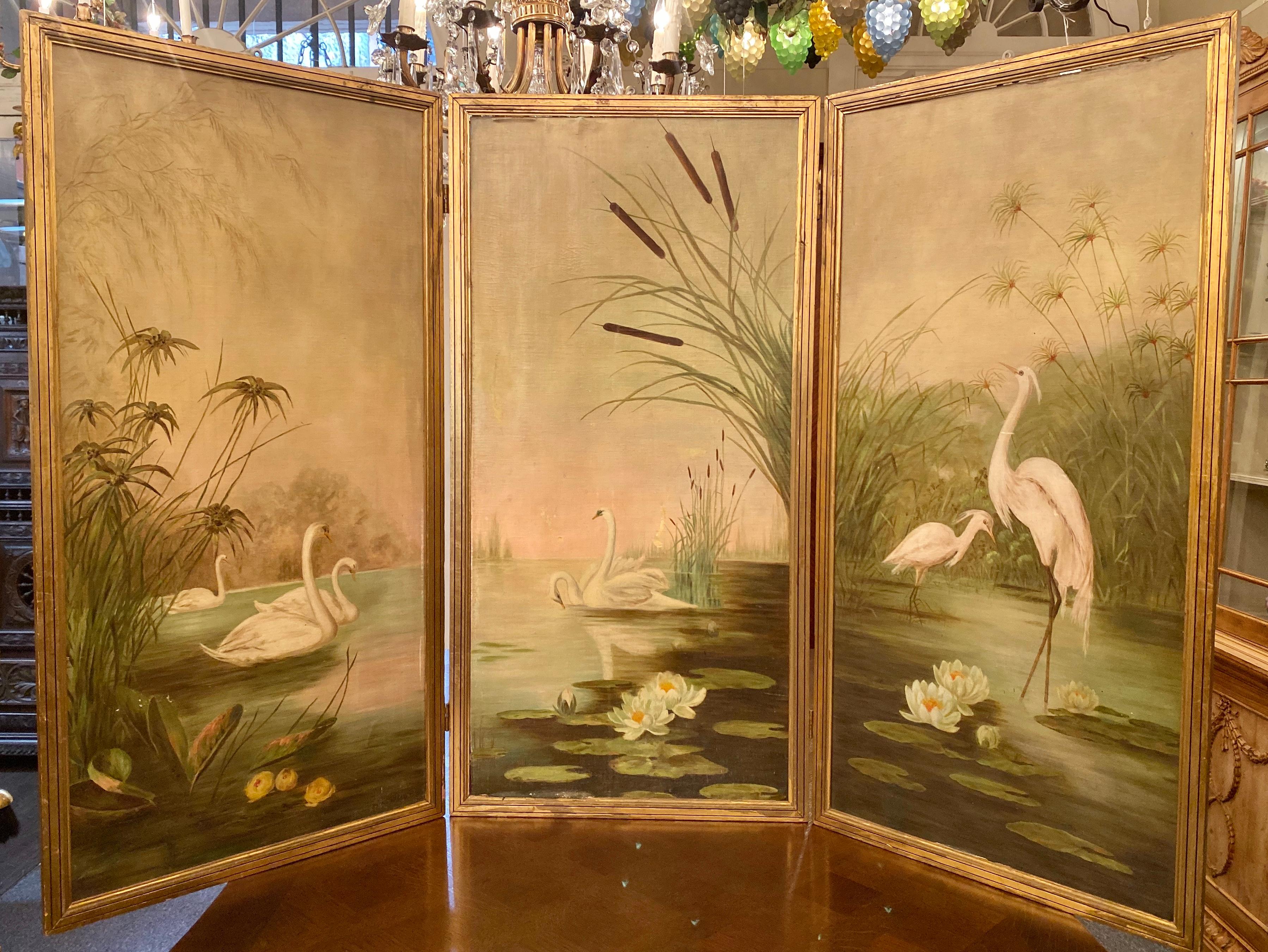 1920s-1930s three paneled screen, aesthetics movement, oil on canvas. Beautiful oil painting of swans and egrets featuring cattails and palmetto plants.
Each panel is 21