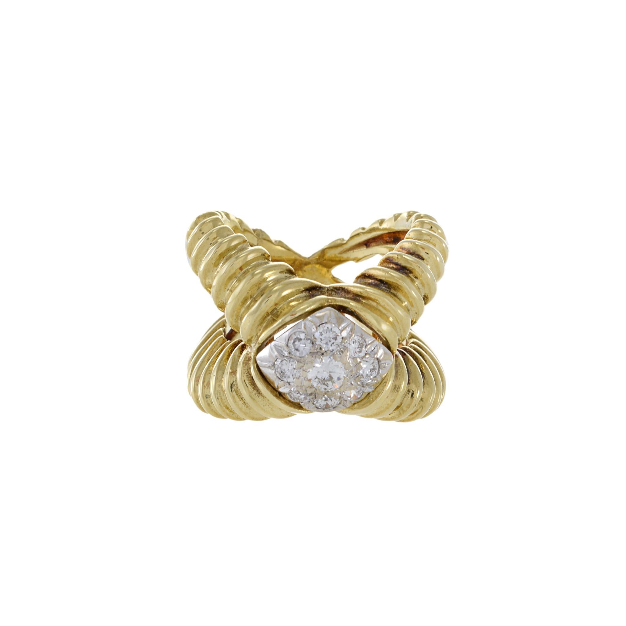 The 1970s design never goes out of style, and this Estate ring is no exception. Crafted with 18KT yellow gold, it features a stunning 0.50CT-TW F-VS diamond crossover wrap. The vintage design and high-quality materials make this ring a timeless