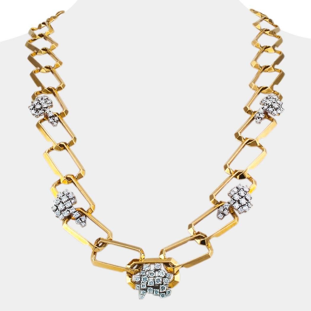  1970’s long diamond and yellow gold link necklace. In every sense, this is a chic and cosmopolitan diamond and gold link necklace that makes a statement for the excellent taste of the woman wearing it. The jewel is fluid and supple as it contours