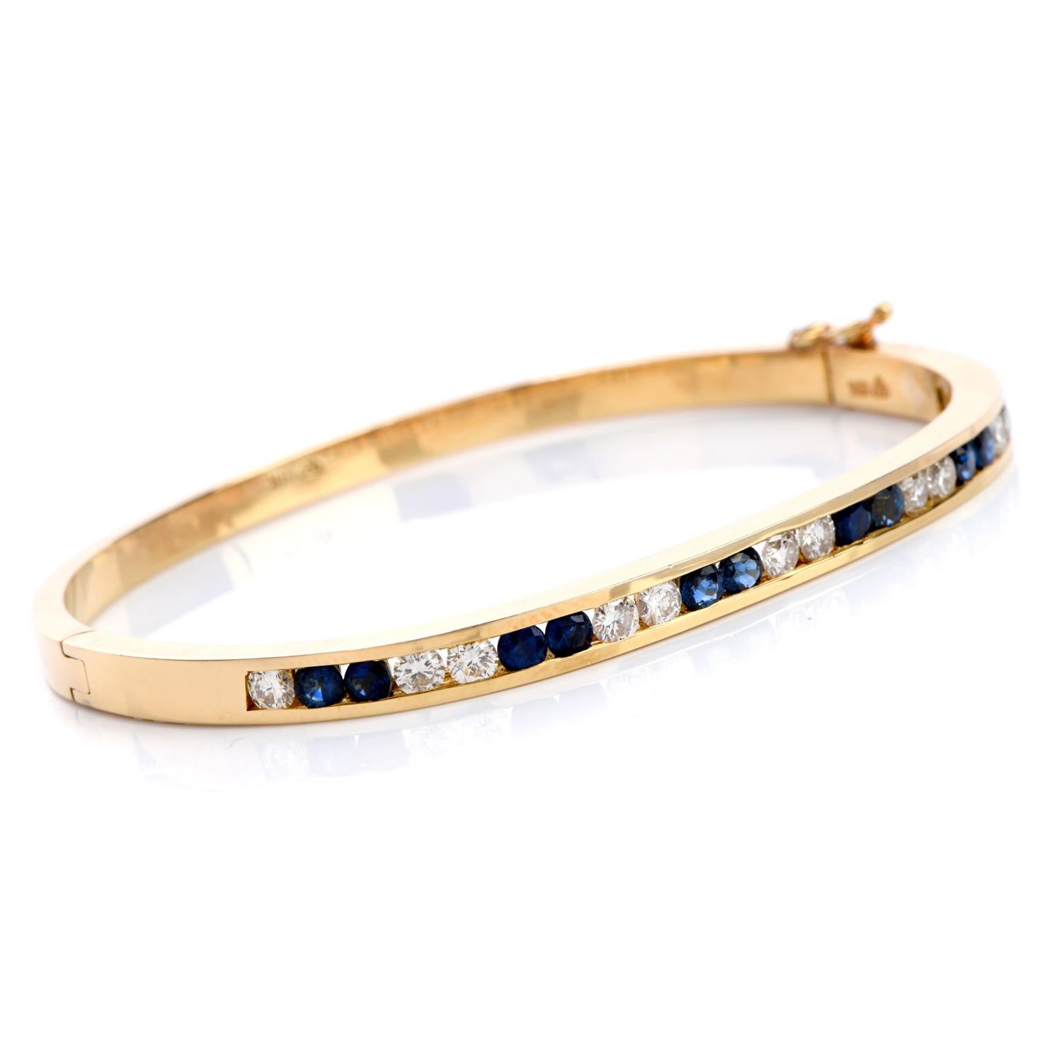 This 1980's bangle bracelet of feminine grace is crafted in solid 18K white gold,

weighing 20.9 grams and measuring 6.5 inches around the wrist.

The enchanting bracelet is enriched with12 channel-set round-cut sapphires, estimated total weight of 