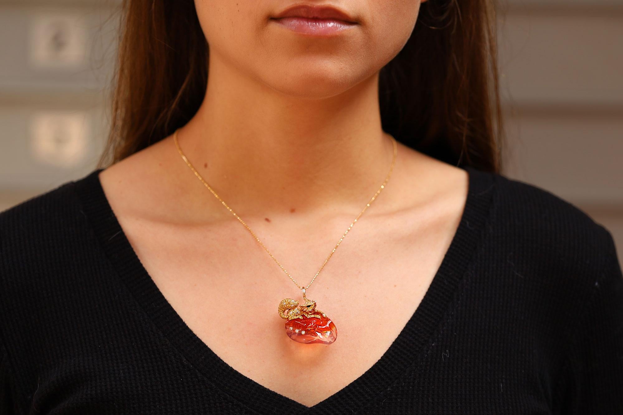 Bask the in the unique beauty of this vintage vulpine pendant necklace. Expertly crafted in 18k rose gold with a free form Mexican fire opal weighing an impressive 19.95 carats. Truly one-of-a-kind, this conversation piece goes to the next level