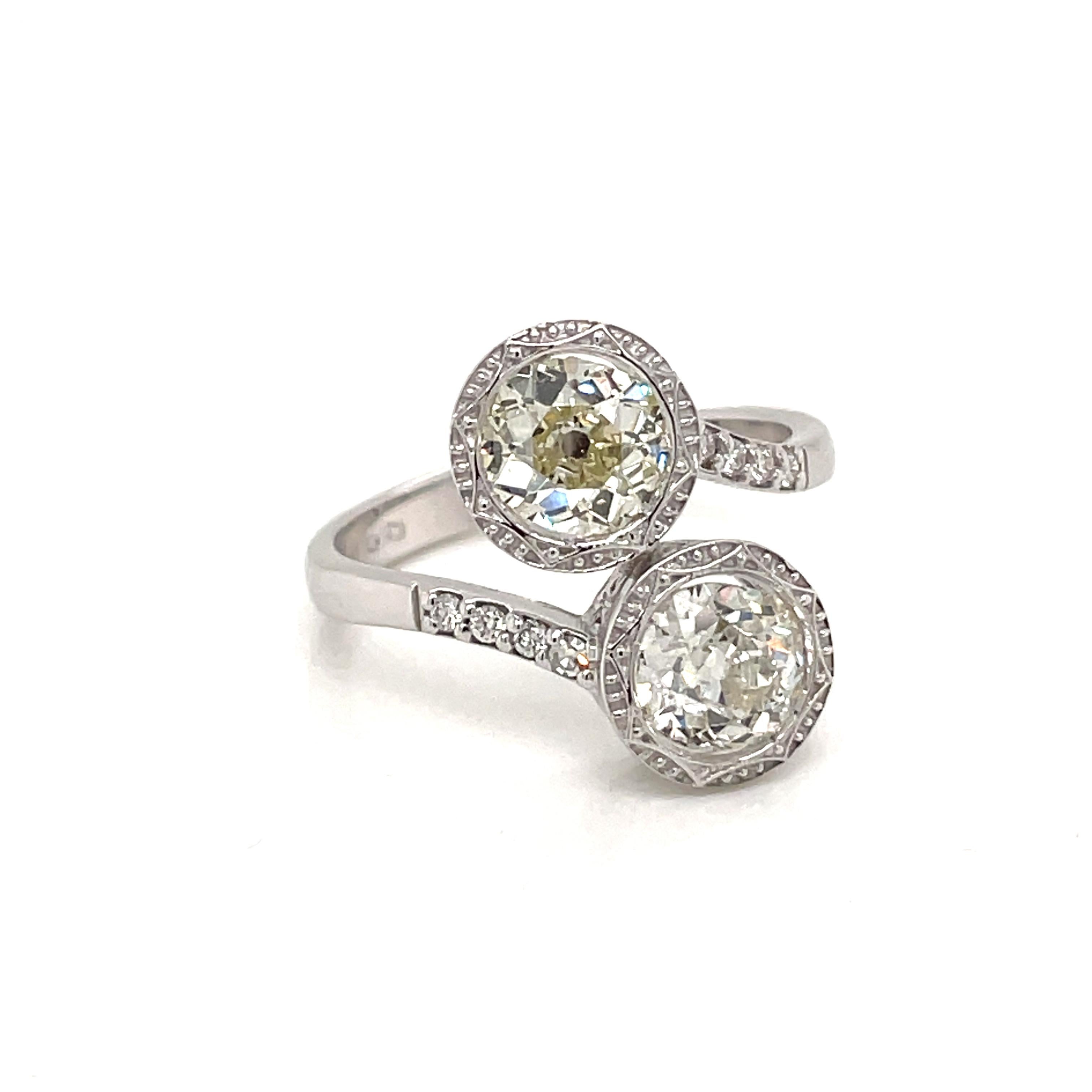 Beautiful Diamond Bypass Ring
An 18K white gold bypass ring, set with two old mine cut diamonds, weights are 1.90 cts for the main diamonds and .10 cts.
Mede in Italy, circa 1980s

CONDITION: Pre-owned - Excellent 
METAL: 18k gold
GEM STONE: Diamond