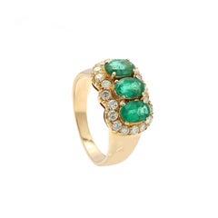 Estate 2.1 ct Oval Emerald Ring with Diamonds Encircling in 18 Karat Yellow Gold