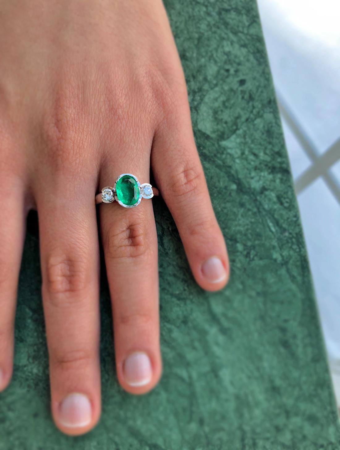 Estate a Classic 2.36 Carat Emerald and Diamond Engagement Ring Three-Stone  18K
Primary Stones: Natural Colombian Emerald
Shape or Cut: Oval Cut
Color/Clarity : Medium Green/ Clarity VS
Emerald Weight : Approx. 1.95 carats (8.5mmx6.4mm)
Second