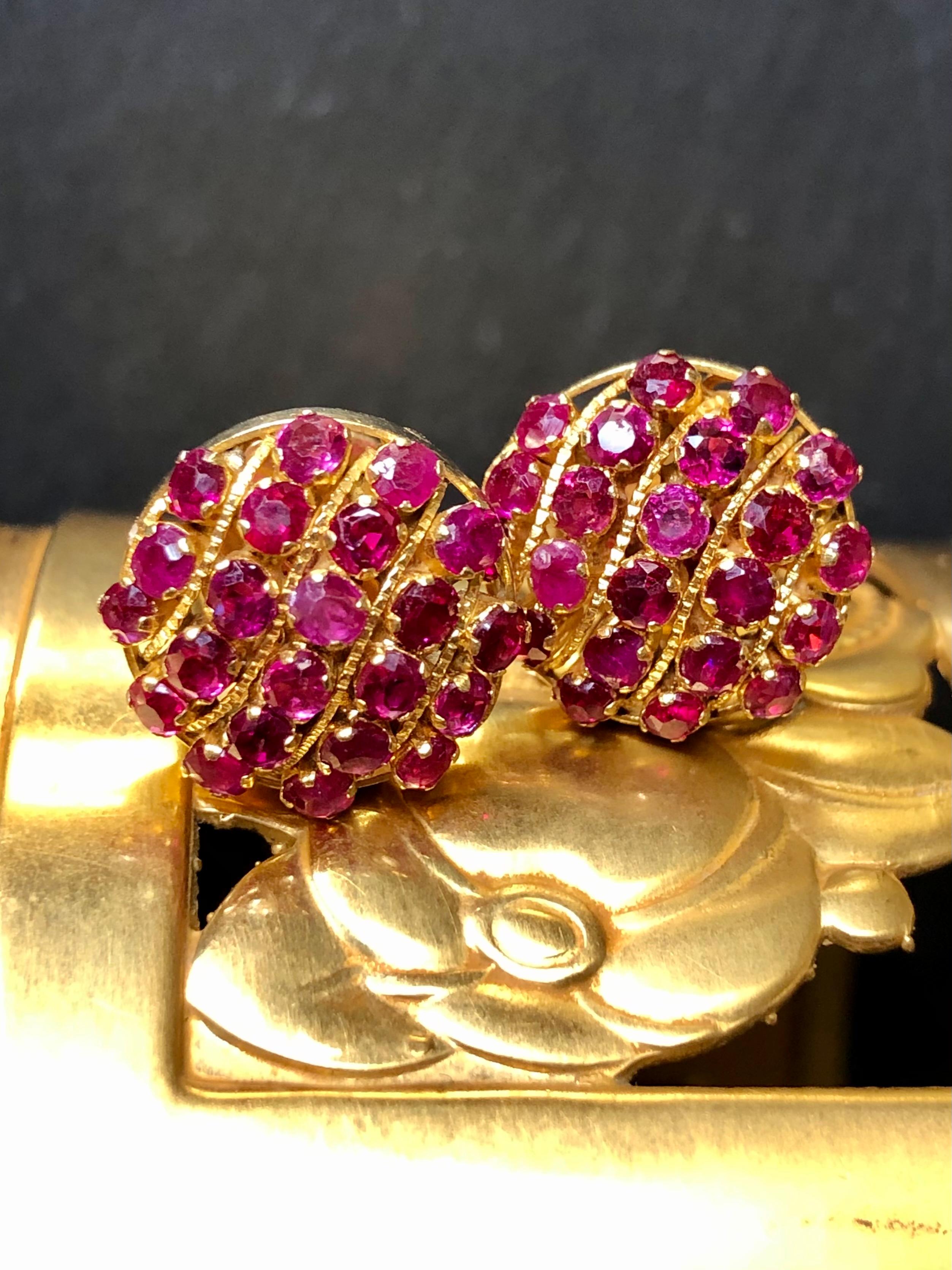
A lovely pair of earrings crafted in deep, 24k yellow gold and prong set with approximately 4cttw in natural, vibrant red rubies.


Dimensions/Weight:

Earrings measure .53” in diameter and weigh 4.7g.


Condition:

All stones are secure and in