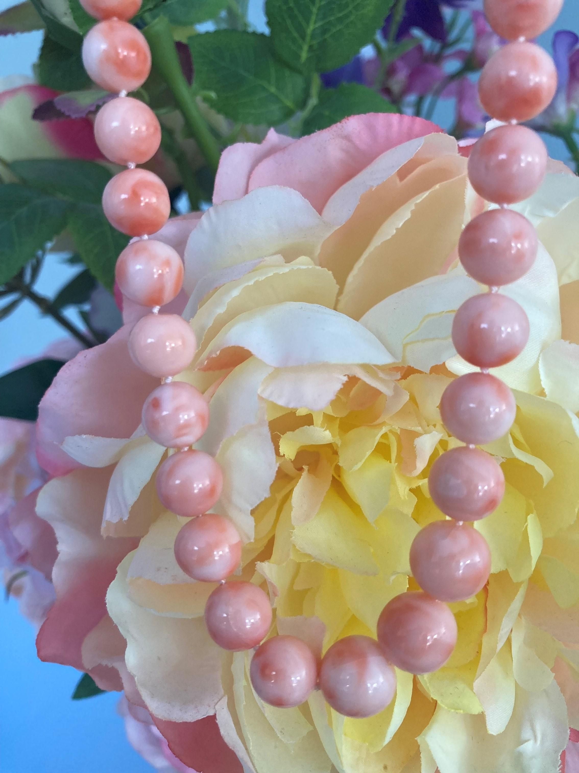 Cover yourself in pink with this bold coral necklace made of large sized blush pink coral beads with a dreamy marble pattern. The polished round beads are methiciously hand picked and graduated in size from a stunning 8-11mm. The necklace has