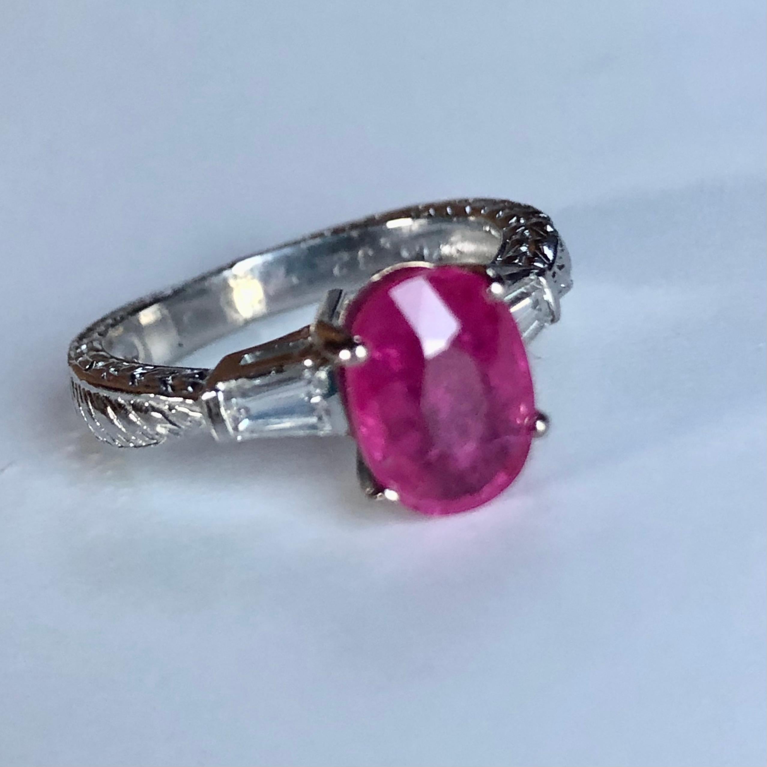 Vintage 2.75 Carat Vintage Ruby Diamond Ring Platinum and 18K
Primary Stone: Natural Ruby(heated low temperature)
Shape or Cut: Oval Cut  
Ruby Weight: 2.43 Carats 
Color: Red Pinkish
Average Clarity: VS  
Accent Stones: Diamond 
Shape or Cut