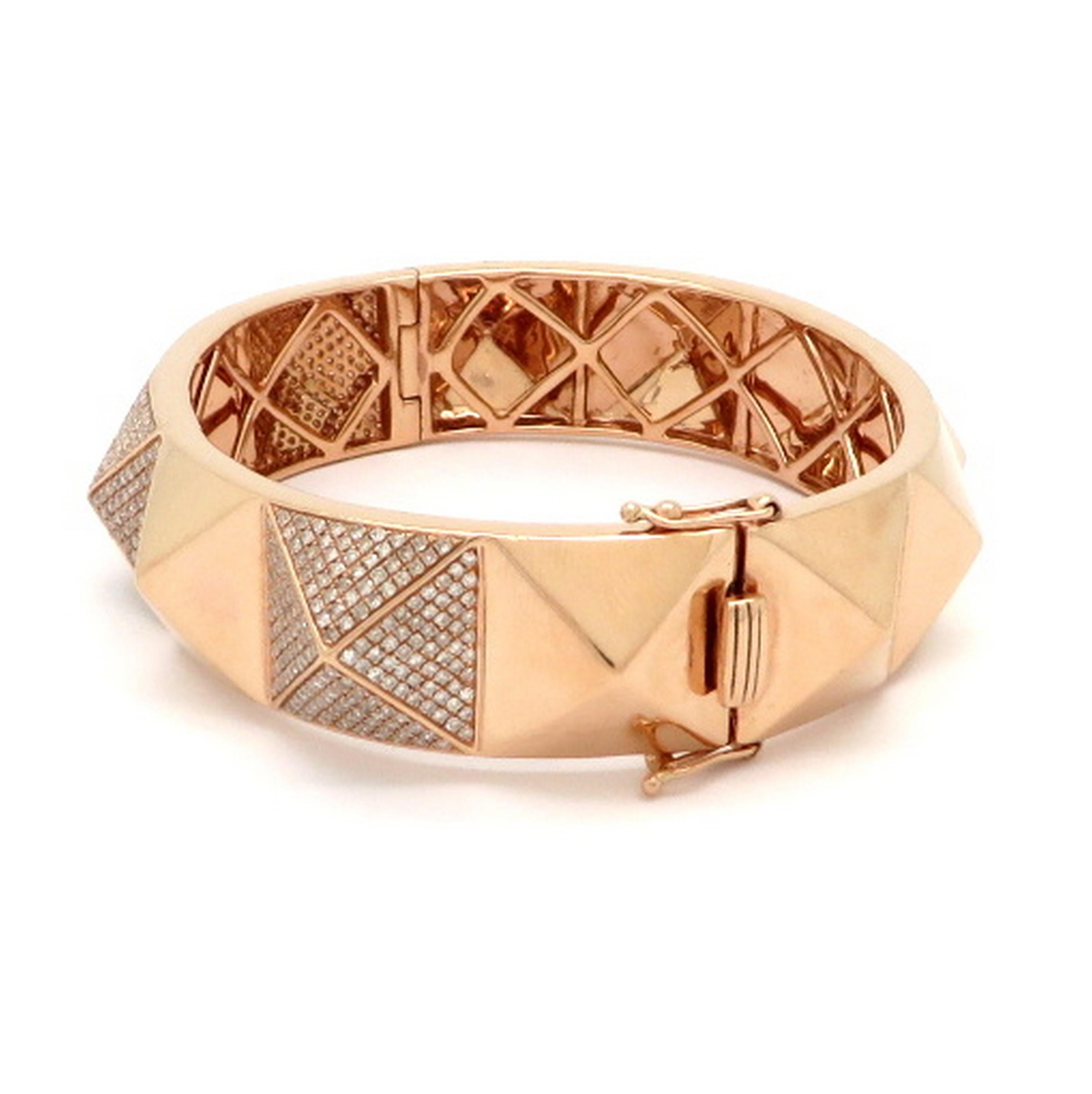 Estate 3.00 carat round diamond pyramid style 14K rose gold bangle bracelet. Showcasing numerous round brilliant cut pave set diamonds weighing a combined total of approximately 3.00 carats. Diamond grading: color grade: I. Clarity grade: SI1. It is