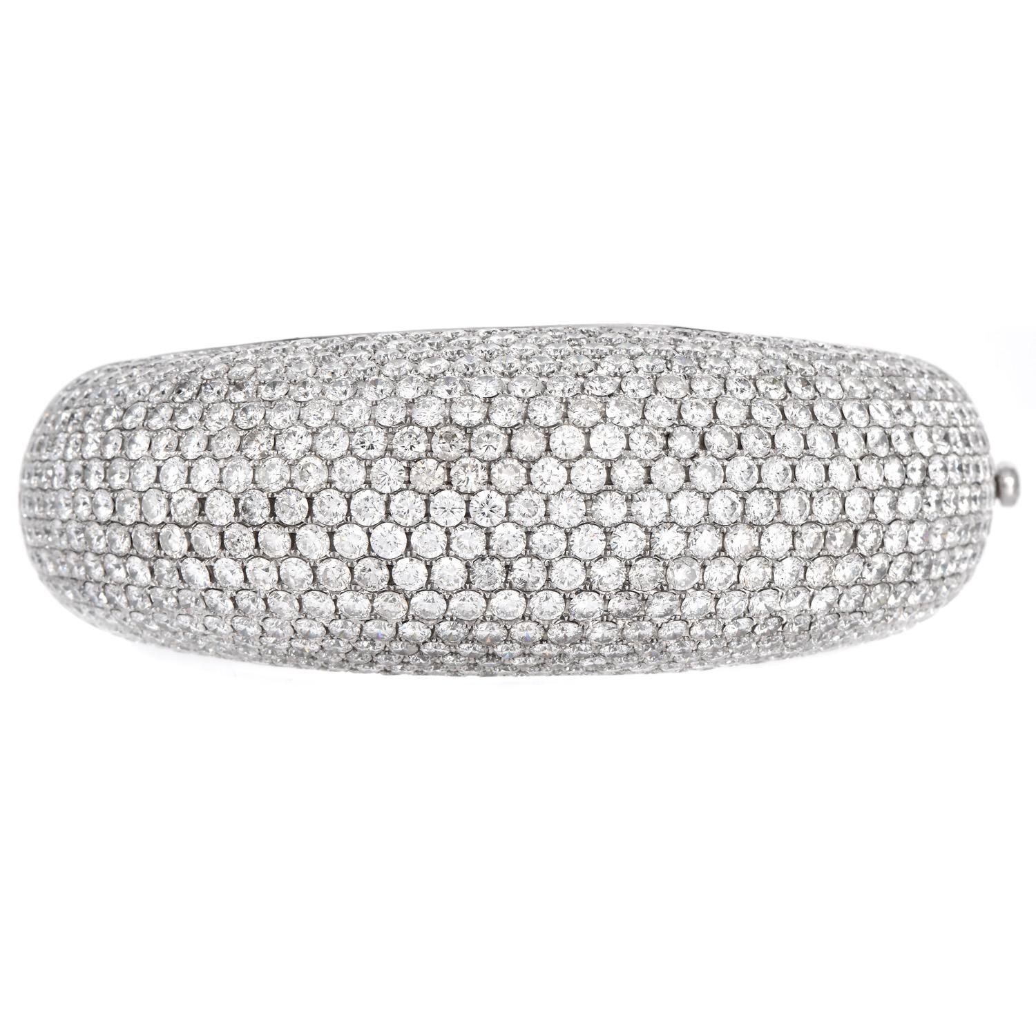 Presenting a Wide Dome Statement Diamond Bangle Bracelet. Prong and Pave set natural Diamonds in line form made in solid 18K White Gold secured with Insert Clasp. Graduating from 15mm wide to 25mm wide bangle. Decorated stunningly with over 568