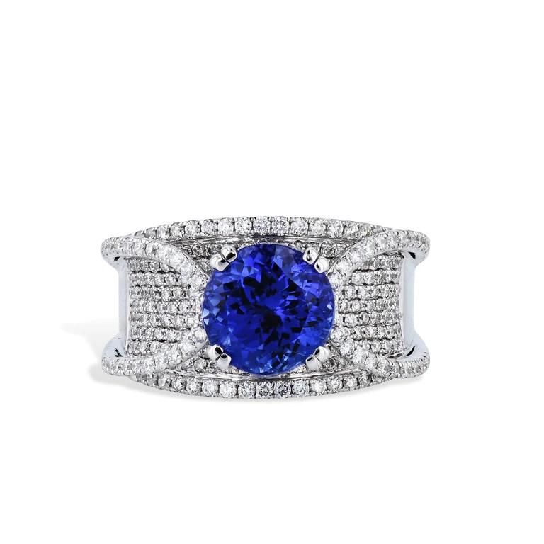 Luxury awaits in this extraordinary White Gold Tanzanite Pave Diamond Estate Ring! Captivating with its 3.49ct Tanzanite center, the design is further accentuated with 274 Round Brilliant Cut Pave Diamonds. Size 7.25. 18kt White Gold. Indulge in