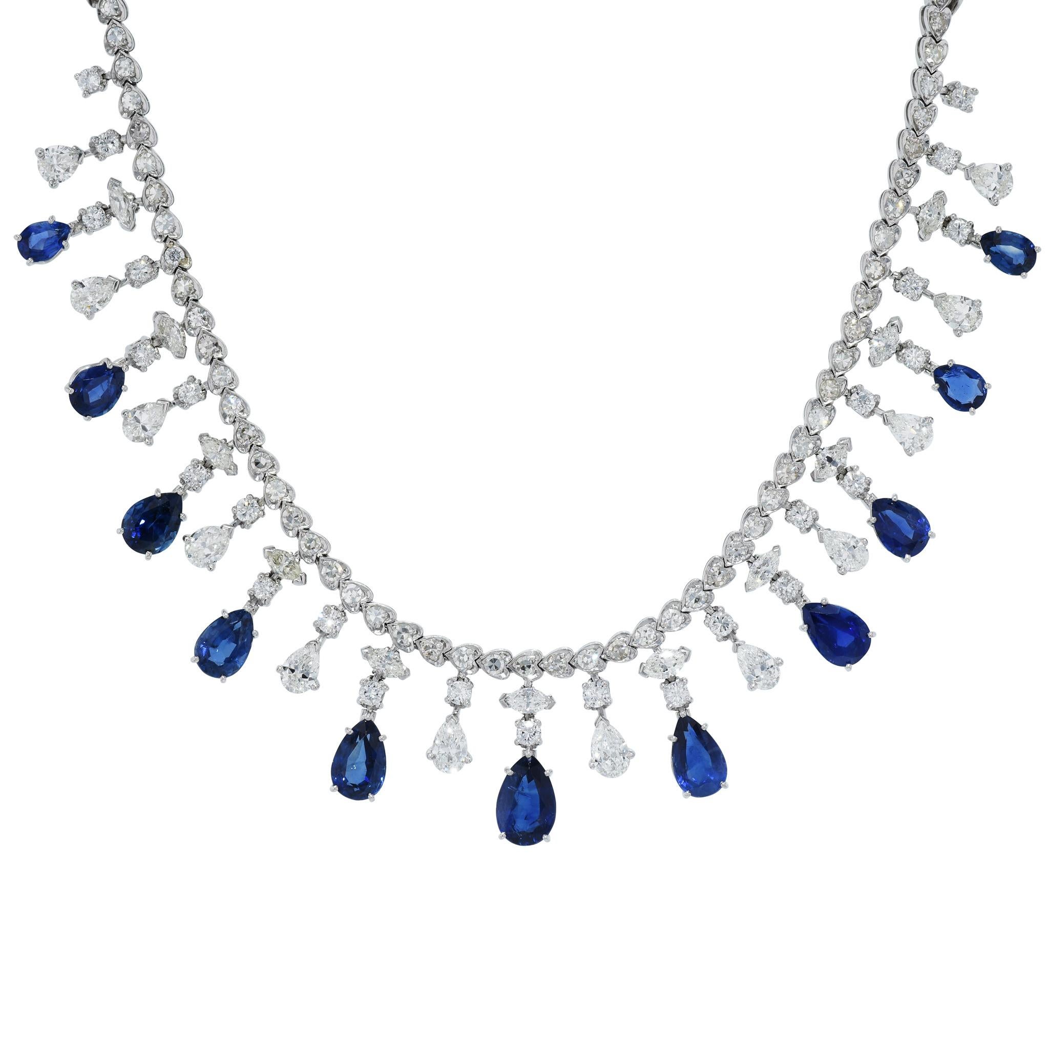 This stunning diamond and sapphire bib-style necklace is an awe-inspiring piece with 11 pear-shaped blue sapphires, 12 pear shaped diamonds, along with round, baguette and marquise cut diamonds.

This piece of art measures 17 inches in length. 
In
