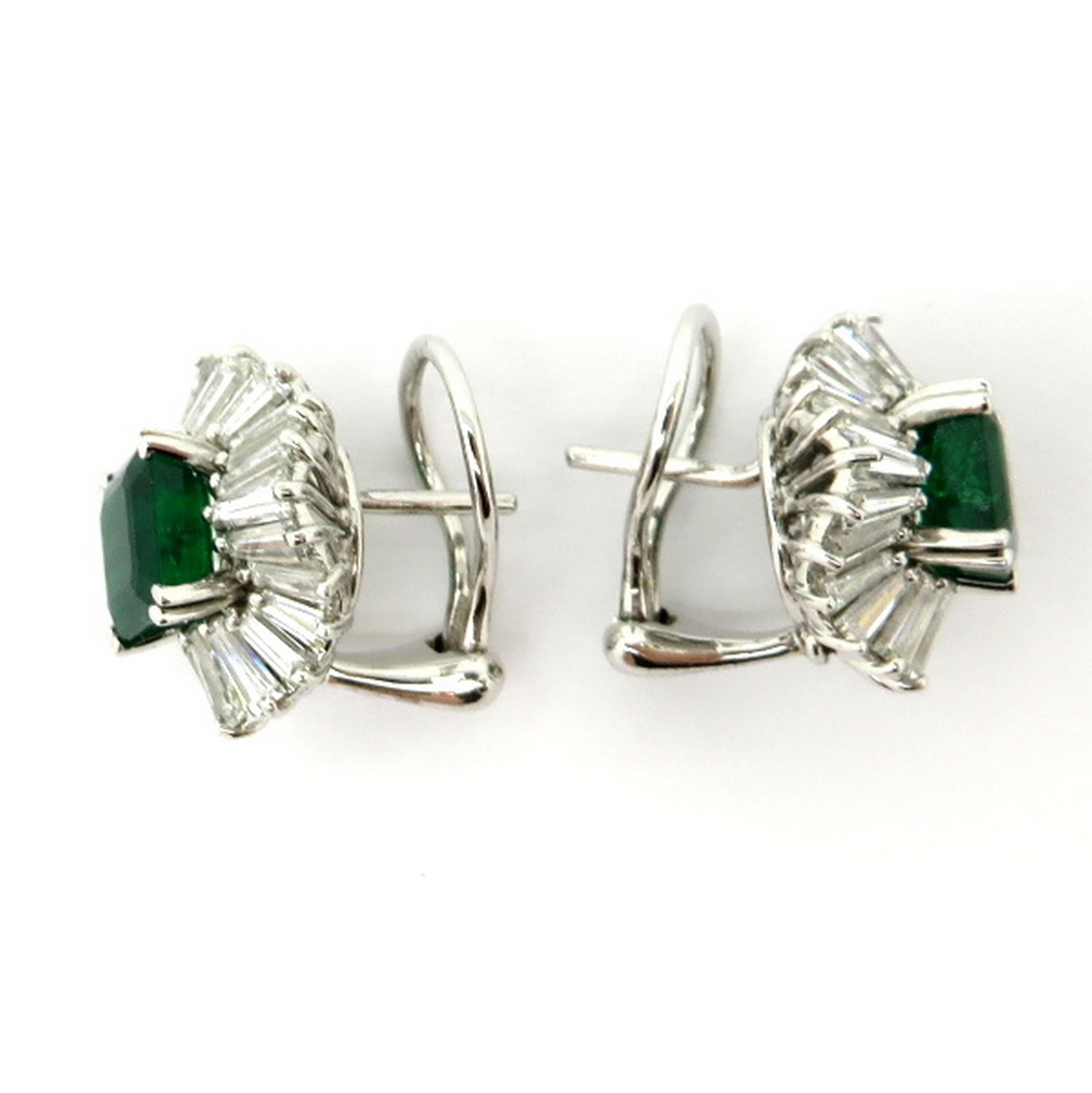 Estate 4.00 carat emerald and 5.00 carat diamond ballerina style earrings. Showcasing two fine quality emerald cut emeralds, claw prong set, weighing approximately 4.00 carats total. Accented with a ballerina halo containing a total of 5.00 carats