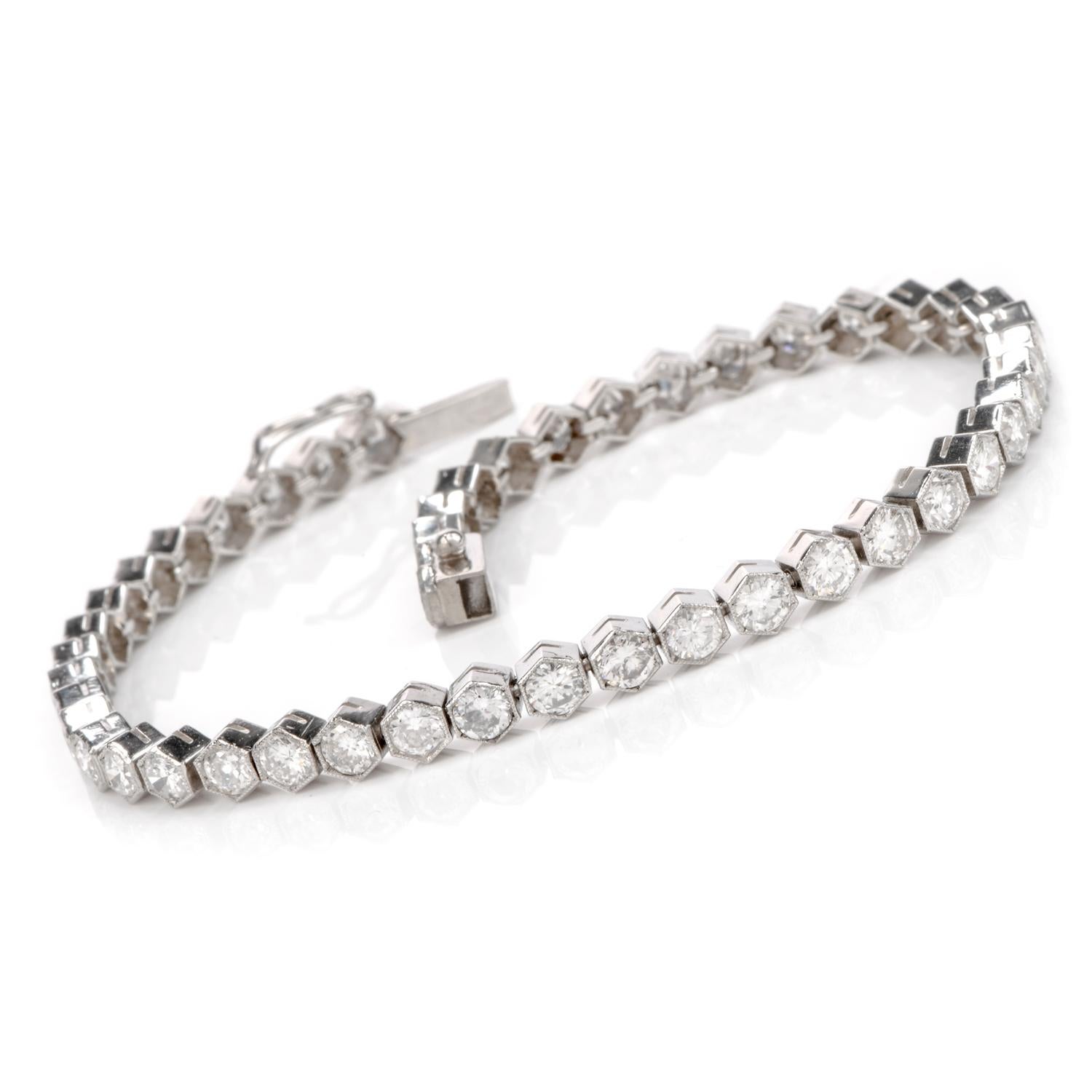 This glistening bracelet was inspired in a geometric repeat

And crafted in luxurious Platinum.

This classic antique style line tennis bracelet design is the host for 48 hand-matched,

bezel set diamonds.  Each bezel contains hand-applied