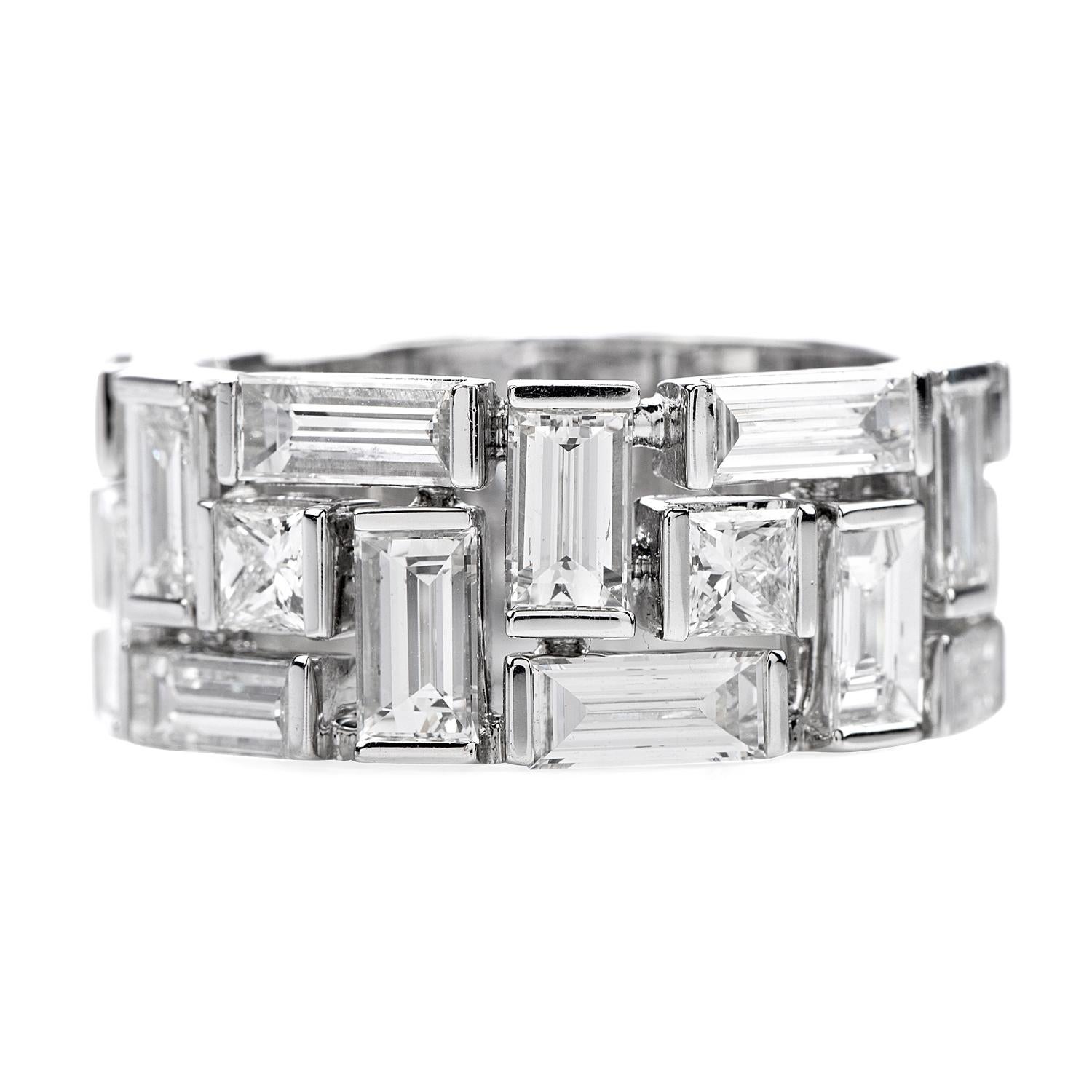 This hand crafted 18k white gold baguette and princess cut diamonds channel set on the rims of

This  abstract design ring feature 16 large Baguette cut diamond weighing approx. 5.20 caratsF-G color, VS1 clarity and 4 square princess cut natural