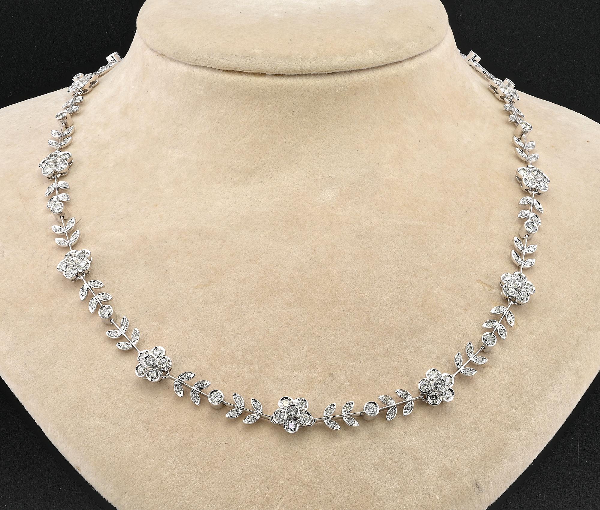 This exquisite estate Diamond necklace is 1990 circa, Italian origin
Beautiful hand crafted of solid 18 Kt white gold
Sober elegance  expressed in the unique design in a delicate version of foliage and daisy flowers combination
Displaying 180 in