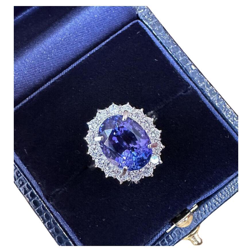 Bague de succession en platine avec tanzanite ovale de 6,63 carats et halo de diamants en vente