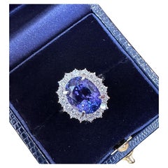 Used Estate 6.63 carats Oval Tanzanite Ring with Halo Diamond in Platinum