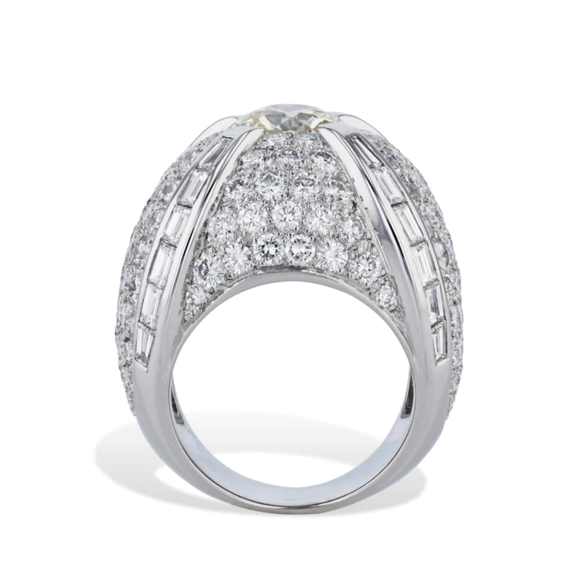 This stunning 18 karat white gold French hallmark dome ring is truly breathtaking! 

It has an 1.49 carat Old European cut center diamond that is K/L in color and VS2 in clarity. 

It also has an additional 122 pieces of round brilliant cut pave