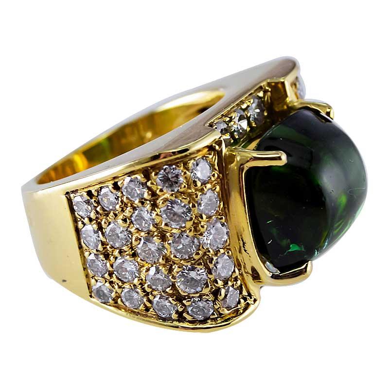 
STYLE / REFERENCE: Pinky Ring
METAL / MATERIAL: 18 KT Yellow Gold
CIRCA / YEAR: Estate
CENTER STONE / WEIGHT: Green Tourmaline 7.50ct
ACCENT STONES / WEIGHT: Diamond / 1.85ctw
COLOR: E/F CLARITY: VS
SIZE:  3 3/4
A large and luminous dark forest