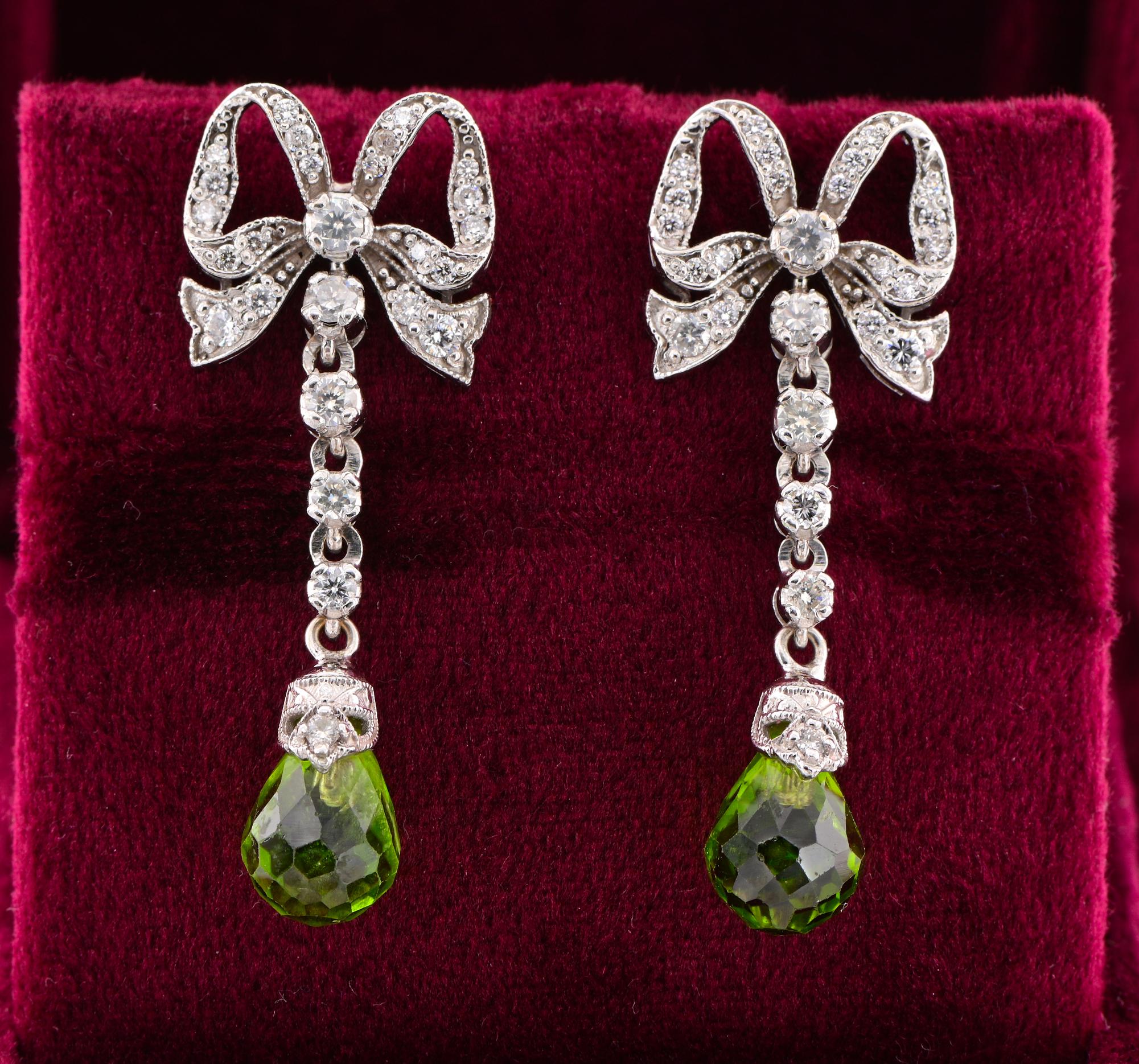 Homage to Femininity
Charming vintage pair of Peridot and Diamond ear drops, mid-century 50/60’s ca.
Classy MUST of Bow Knot design, drop style, artful rendered of solid Platinum, epitome of elegance and timeless beauty
They are surmounted by 1.40