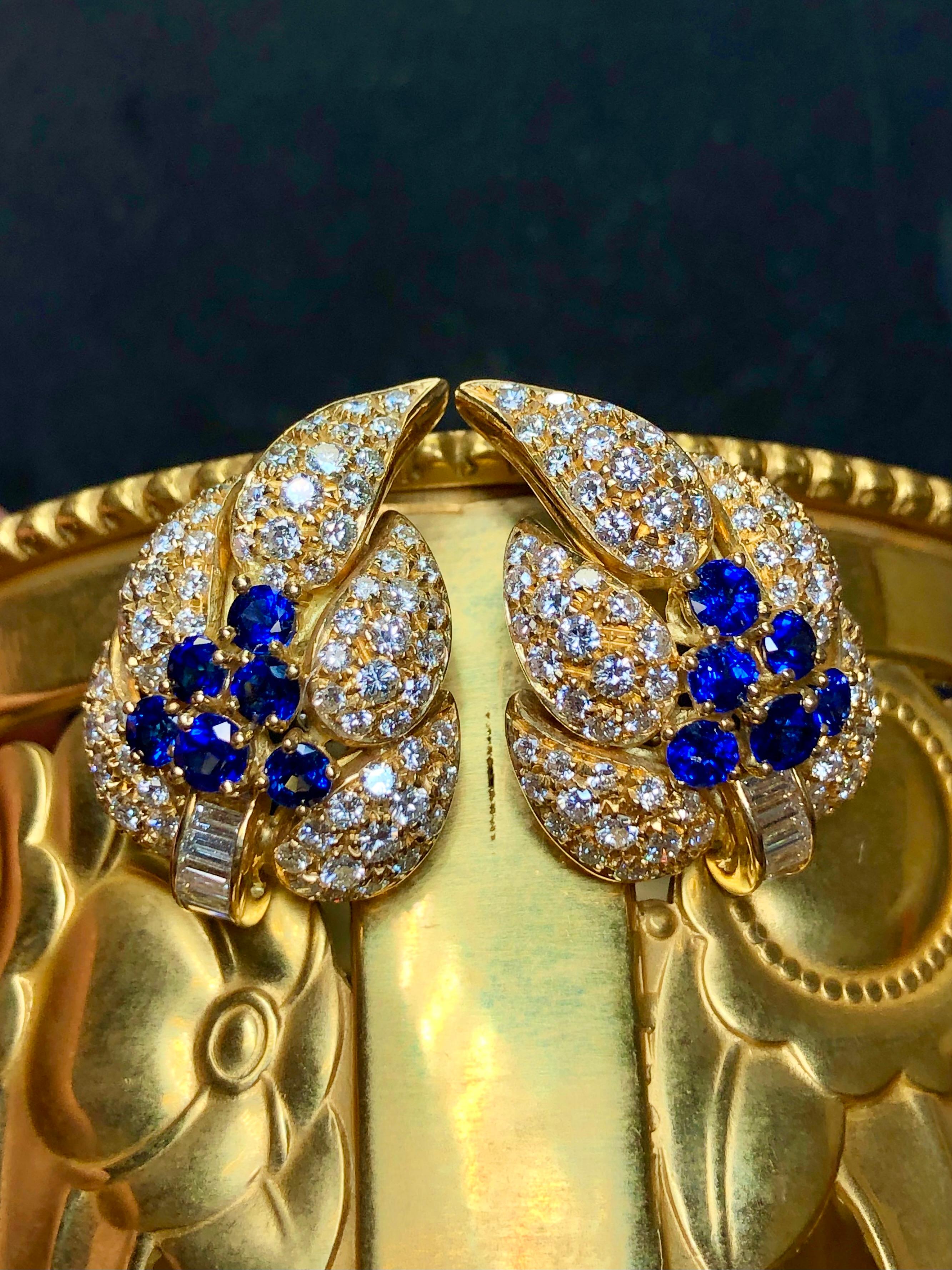 The pictures speak for the themselves but wow! These earrings are hand crafted in 18K yellow gold and set with approximately 1.80cttw in bright royal blue sapphires as well as 4.24cttw in F-G color Vs1-2 clarity round and baguette diamonds. Earrings