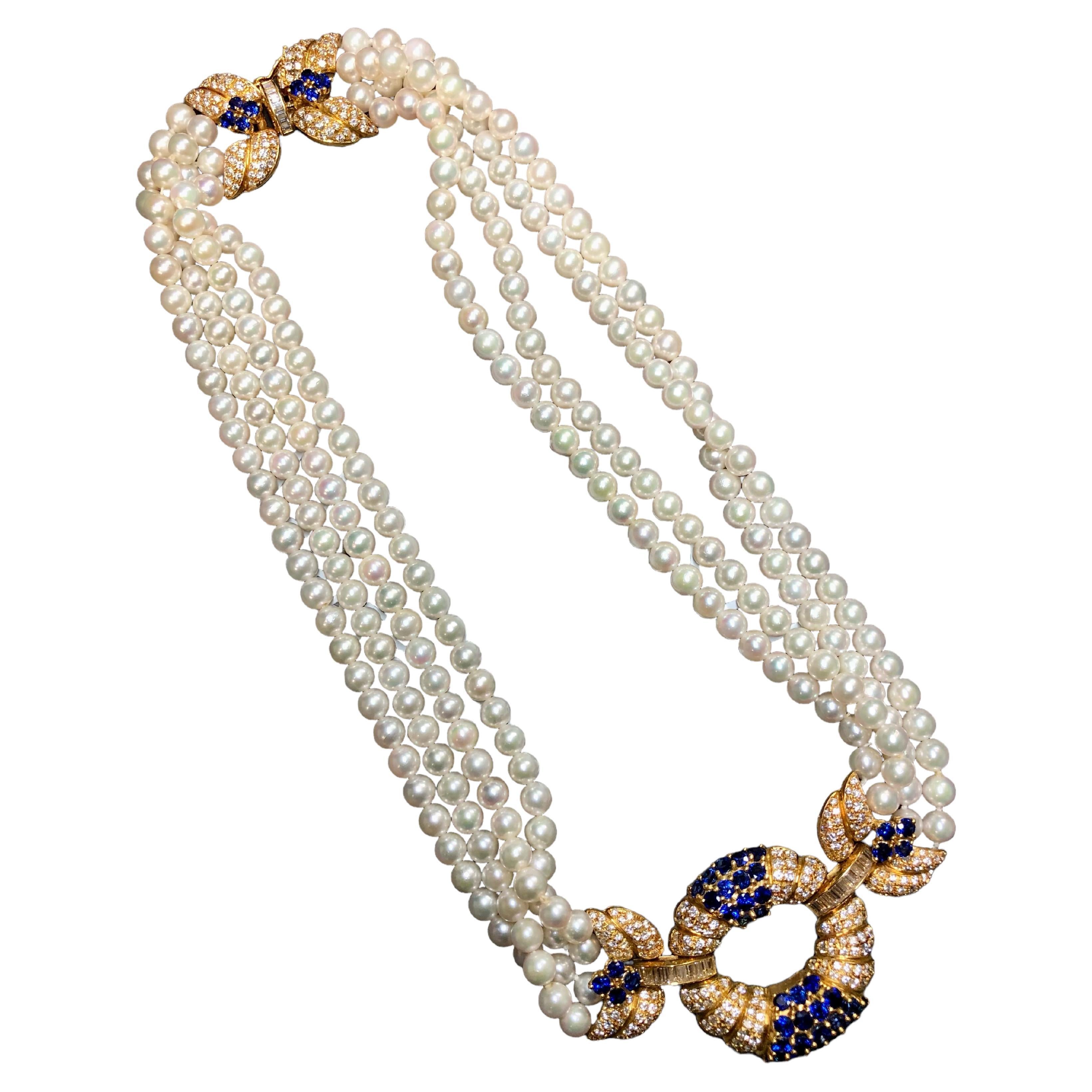 An absolutely spectacular Italian made necklace done in 18K yellow gold and strung together with 5.95mm cultured pearls. All sections of this necklace are adorned with F-G color Vs1-2 clarity round and baguette diamonds having a total approximate