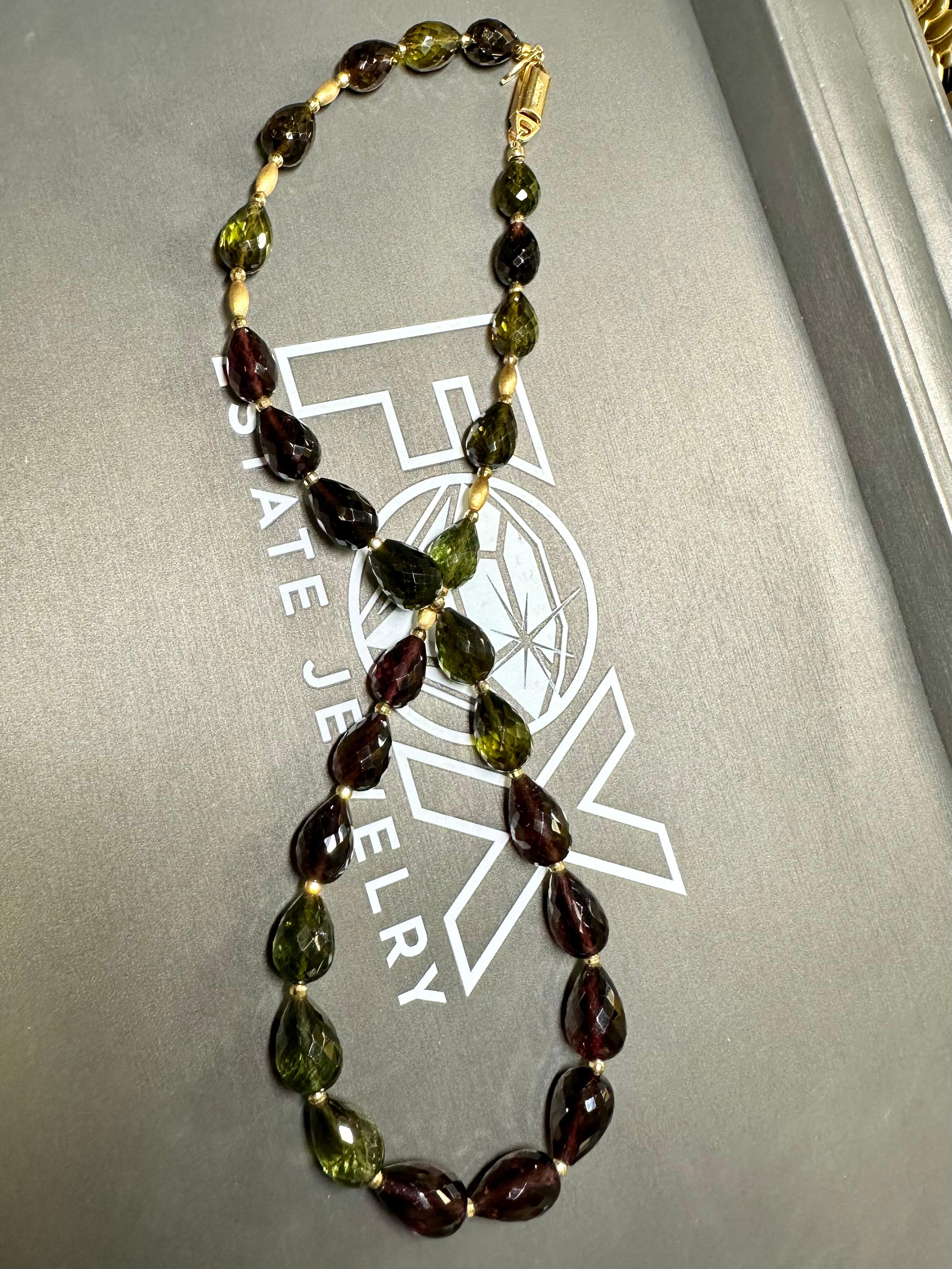 
A beautifully unique necklace done with natural briolette cut green and pink tourmaline separated by deep 18K yellow gold rondelles. There is approximately 150cttw in tourmaline strung on the gorgeous piece. Truly a unique