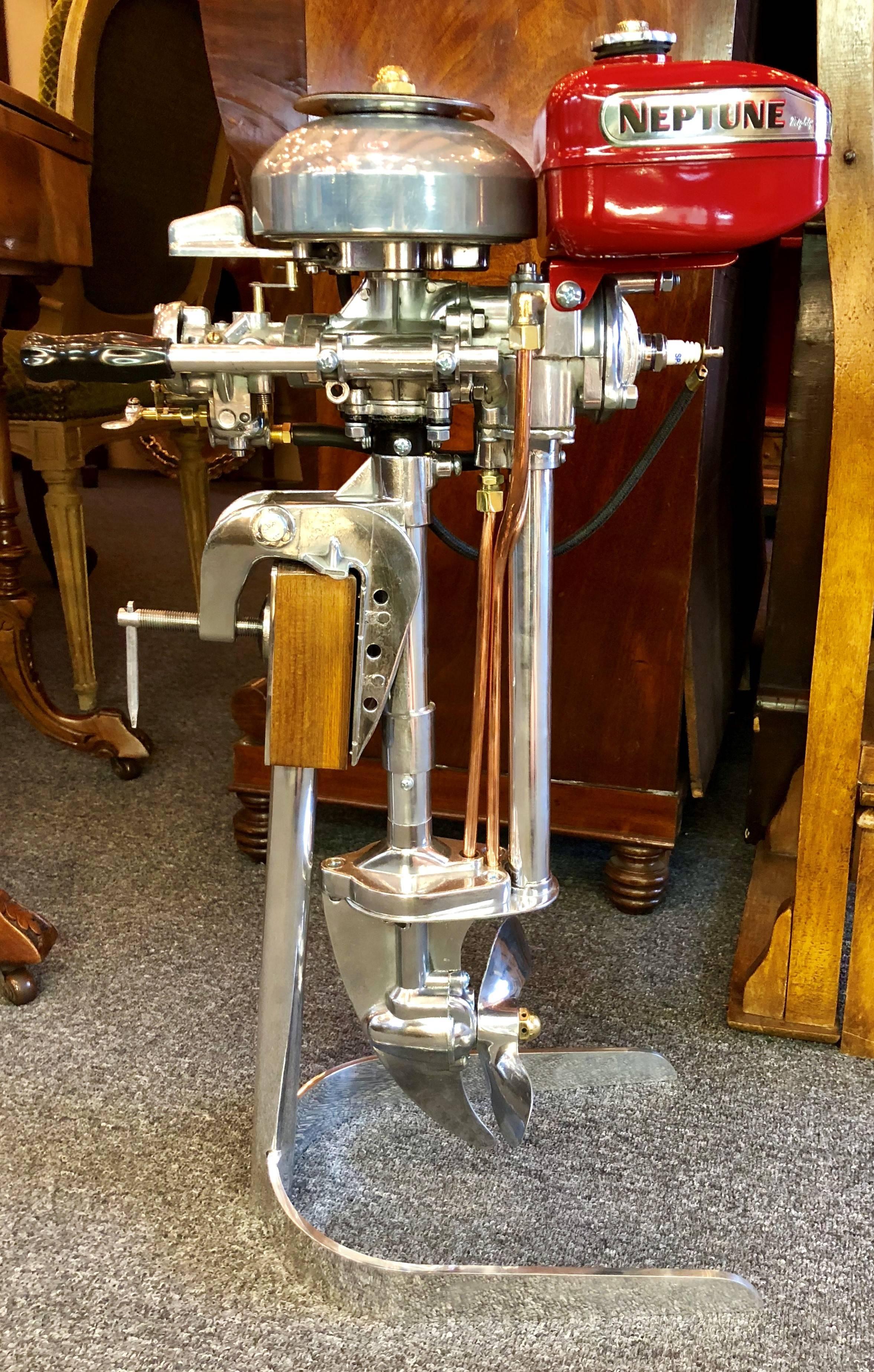 Estate American mighty mite outboard motor mounted on custom-made stand, circa 1950-1960.
Base is 12