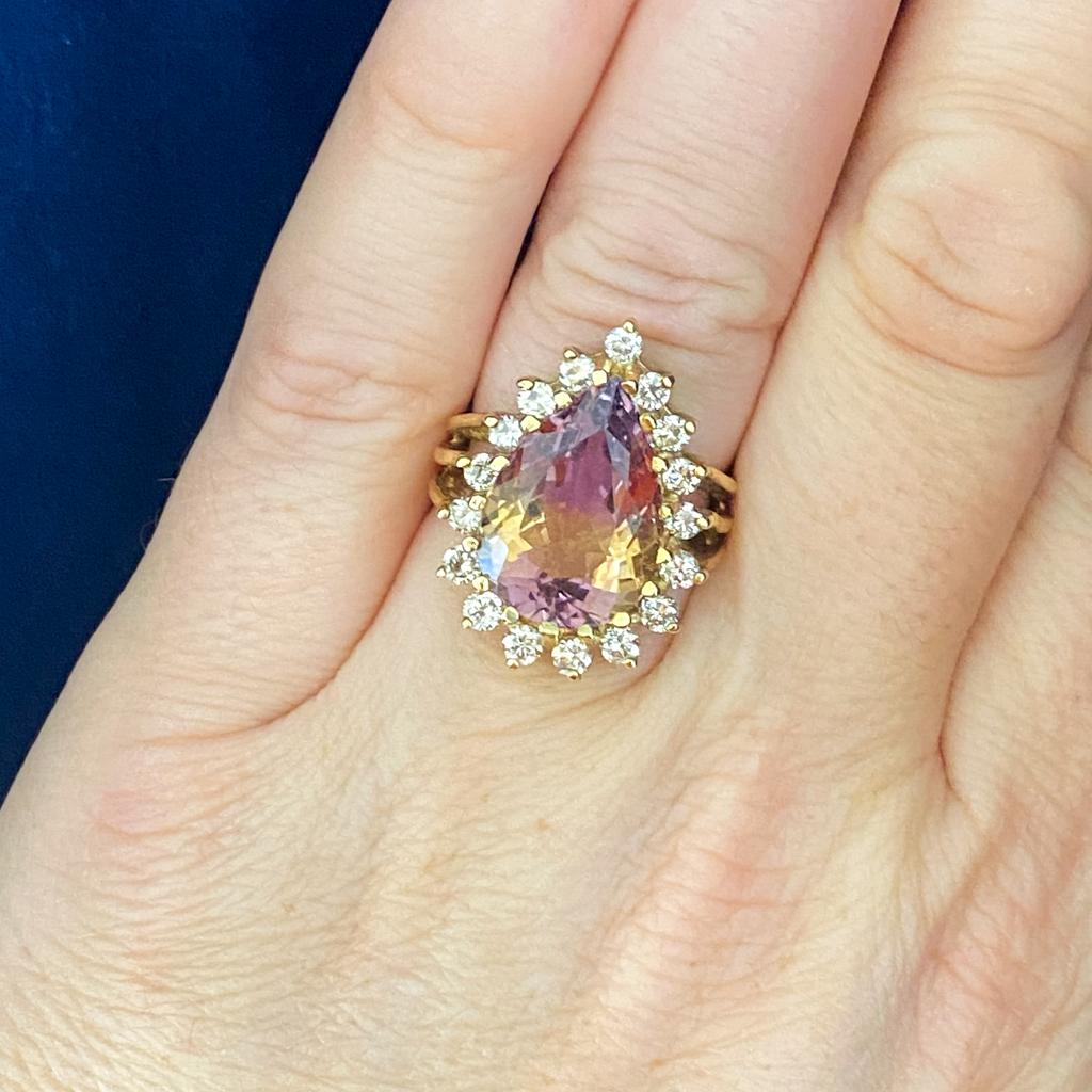 This beautiful ametrine and diamond ring is a special piece of fine jewelry from days past, in excellent condition! Ametrine is both citrine and amethyst together in one crystal, formed in unusual growing conditions, primarily mined in Bolivia,