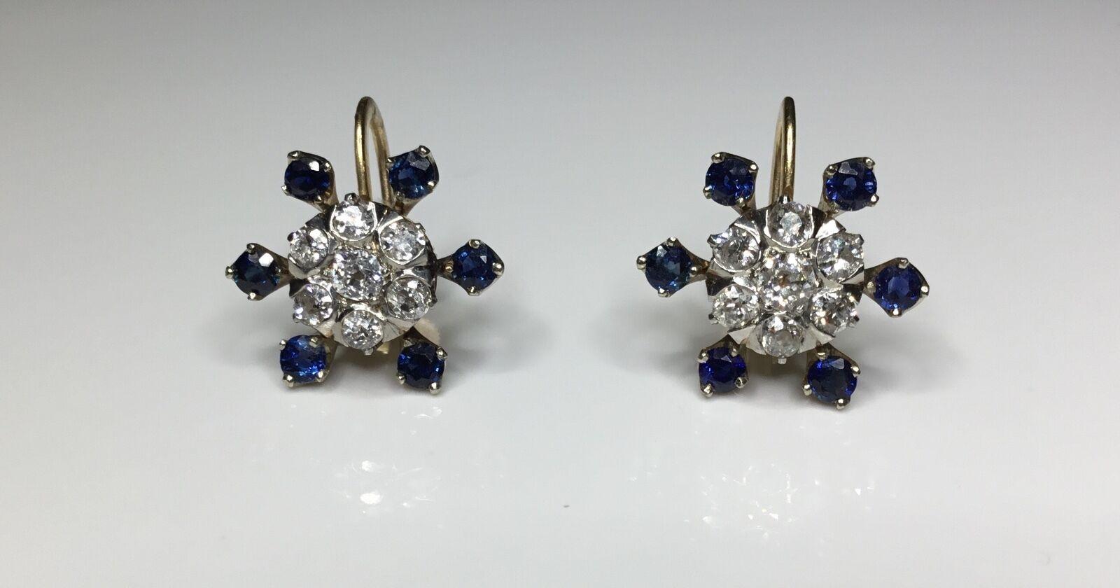 Details:

Estate Antique 14K Yellow Gold 2.50 CTW Old Mine Cut Diamond & Sapphire Clip-on Earrings

There 14 Round Natural Old Mine Cut Diamonds Weighing Approximately 1.30 Carat Total Weight.
Color Grade: G-H
Clarity Grade: VS-SI1

12 Round Natural