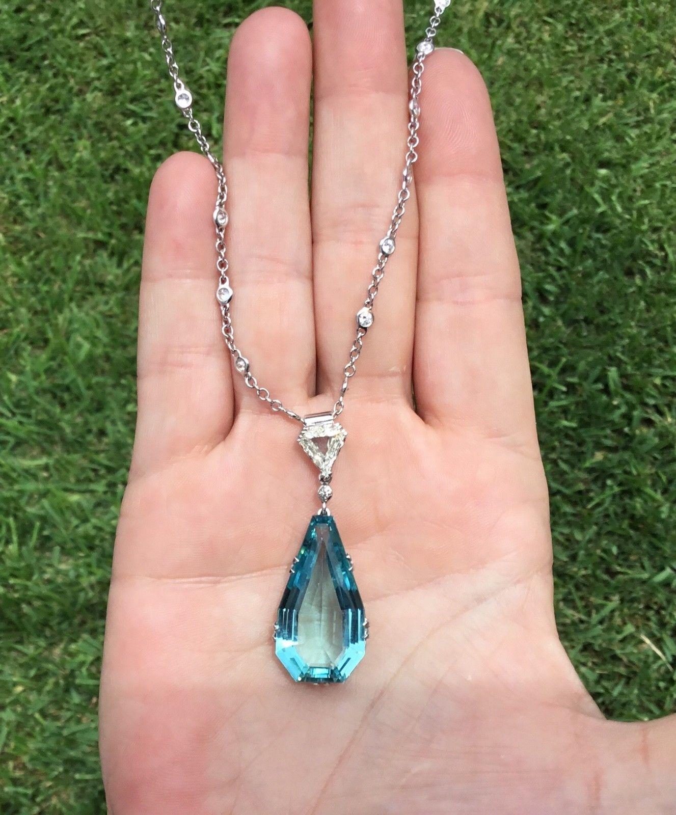 Estate Antique 18K White Gold 20.08 CTW Natural Aquamarine & Diamond Necklace

One Pear Shaped Natural Aquamarine, 
Weighing Approximately 17.30 Carat Total Weight.


One Cut Corned Trillion Shaped Natural Diamond, 
Weighing Approximately 1.50 Carat