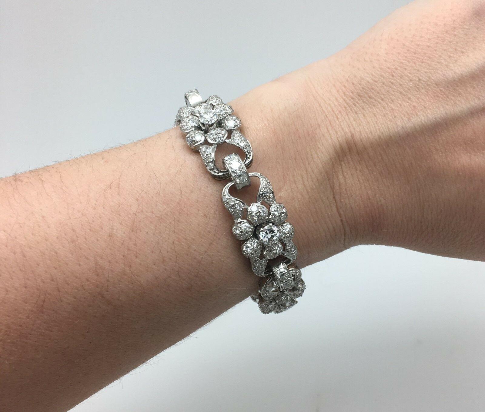 Estate Antique Art Deco Platinum 12.00 CTW Diamond Tennis Bracelet 44.2 Grams

There Are 6 Round Old European Cut Natural Diamonds, Of About 0.50 Points Each, 
Weighing Approximately 3.00 Carat Total Weight.  
Color Grade: G-H
Clarity Grade: