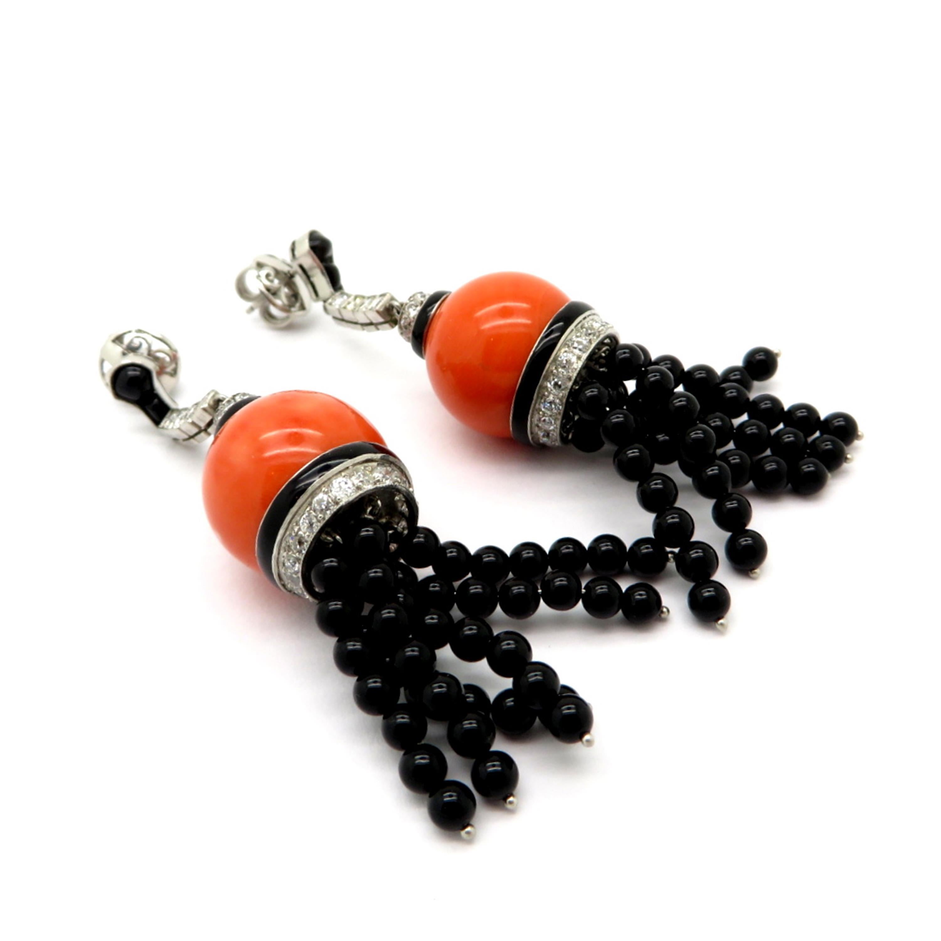 Estate antique coral diamond and black onyx platinum tassel dangle earrings. Interspersed with 64 Old European cut and round brilliant cut diamonds with various measurements weighing a combined total of approximately 1.30 carats. Diamond grading: