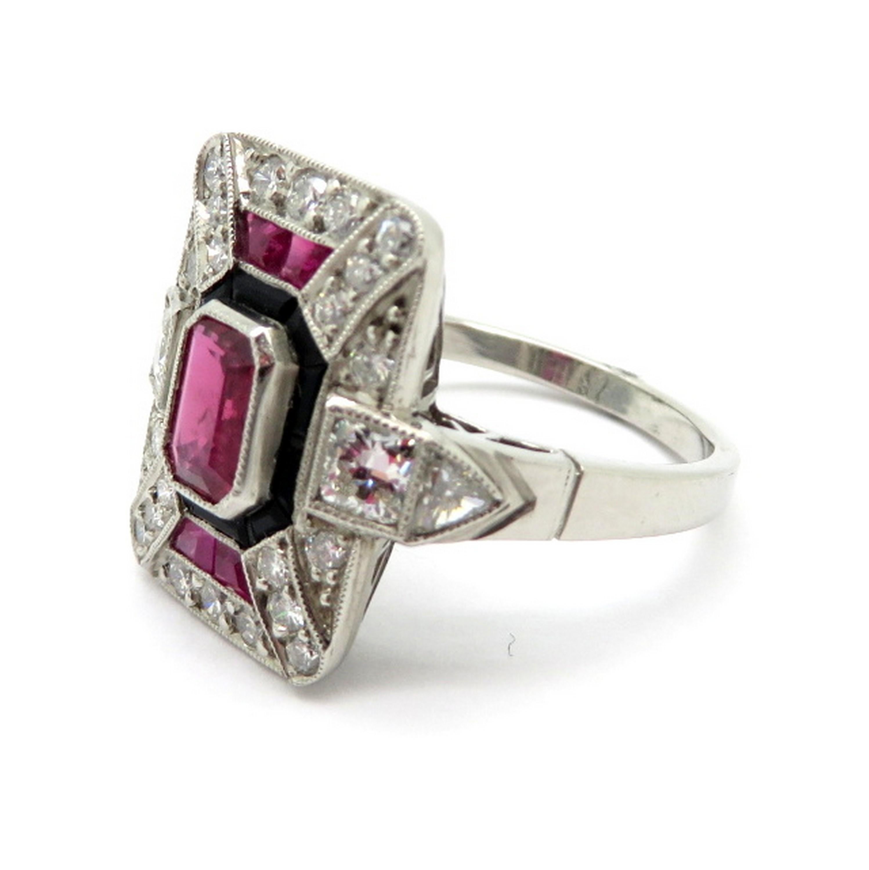 Estate antique platinum diamond ruby and onyx Art Deco style ring. Centering one emerald cut milgrain bezel set fine quality ruby weighing approximately 0.60 carats. Accented with four calibre cut fine quality rubies weighing approximately 0.75