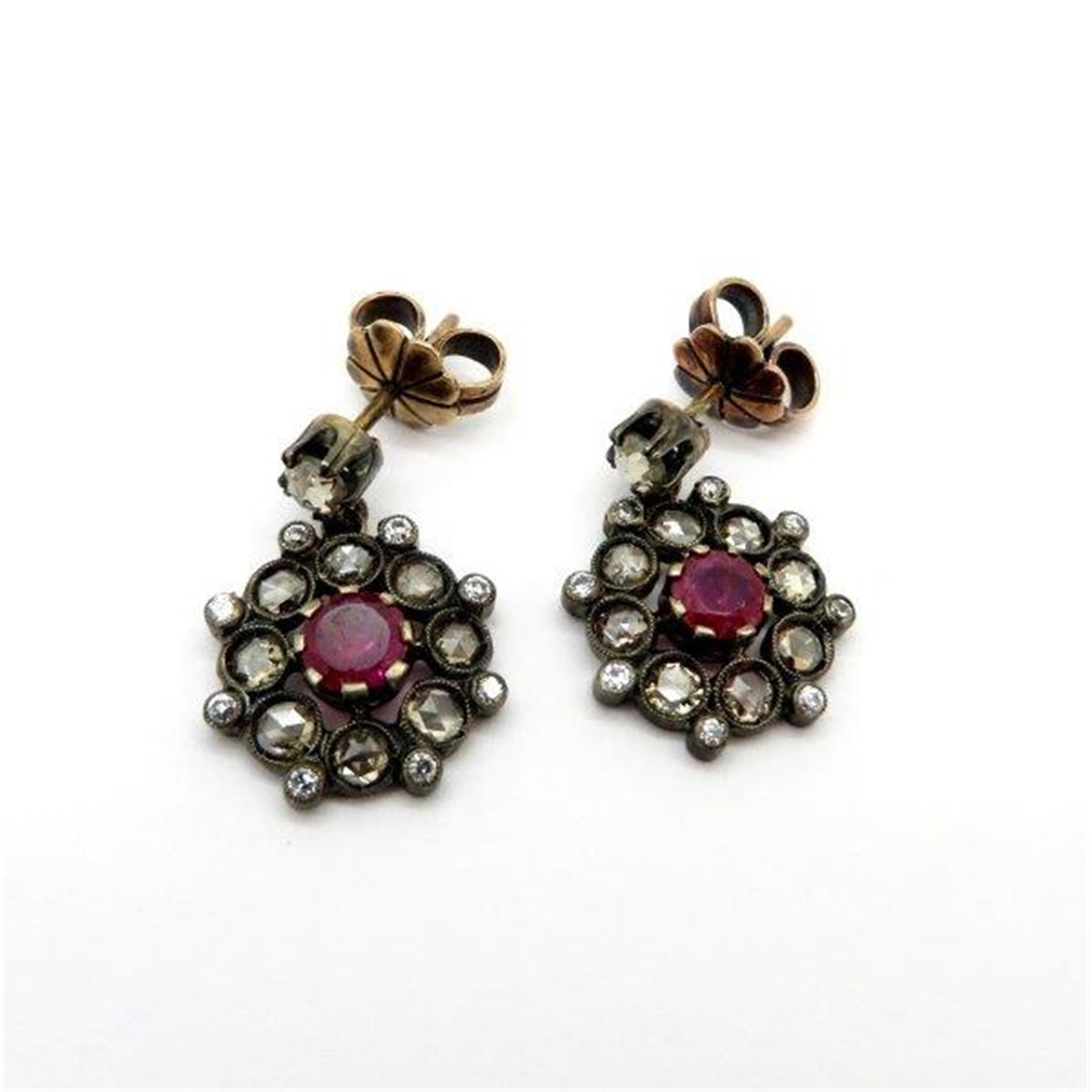 Estate Victorian style ruby and rose cut diamond dangle flower earrings. The earrings are crafted out of platinum and 18K yellow gold. Featuring two round brilliant cut fine quality rubies, prong set, weighing approximately 1.00 carat total.