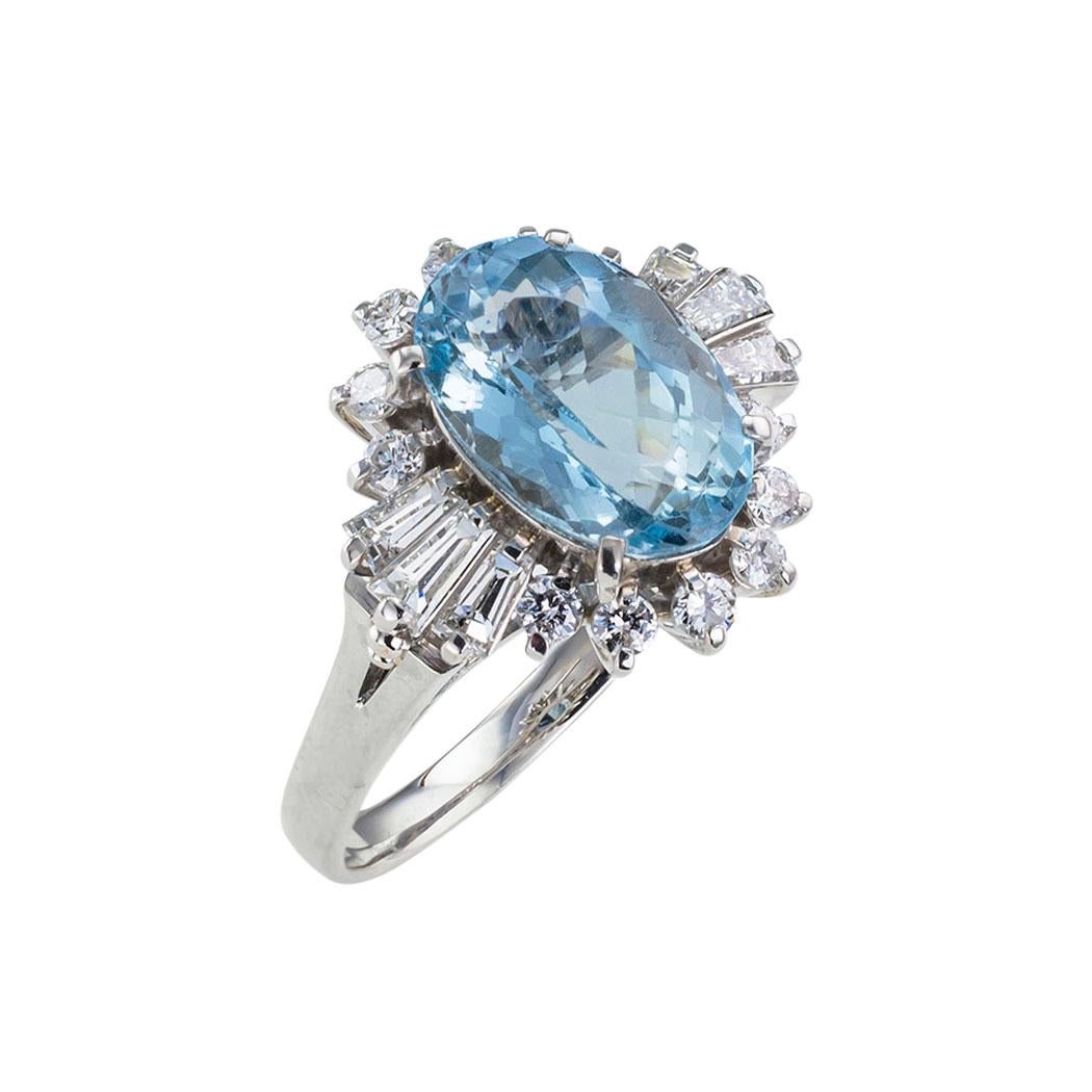 Aquamarine diamond and platinum cluster ring circa 1990.  Clear and concise information you want to know is listed below.  Contact us right away if you have additional questions.  We are here to connect you with beautiful and affordable