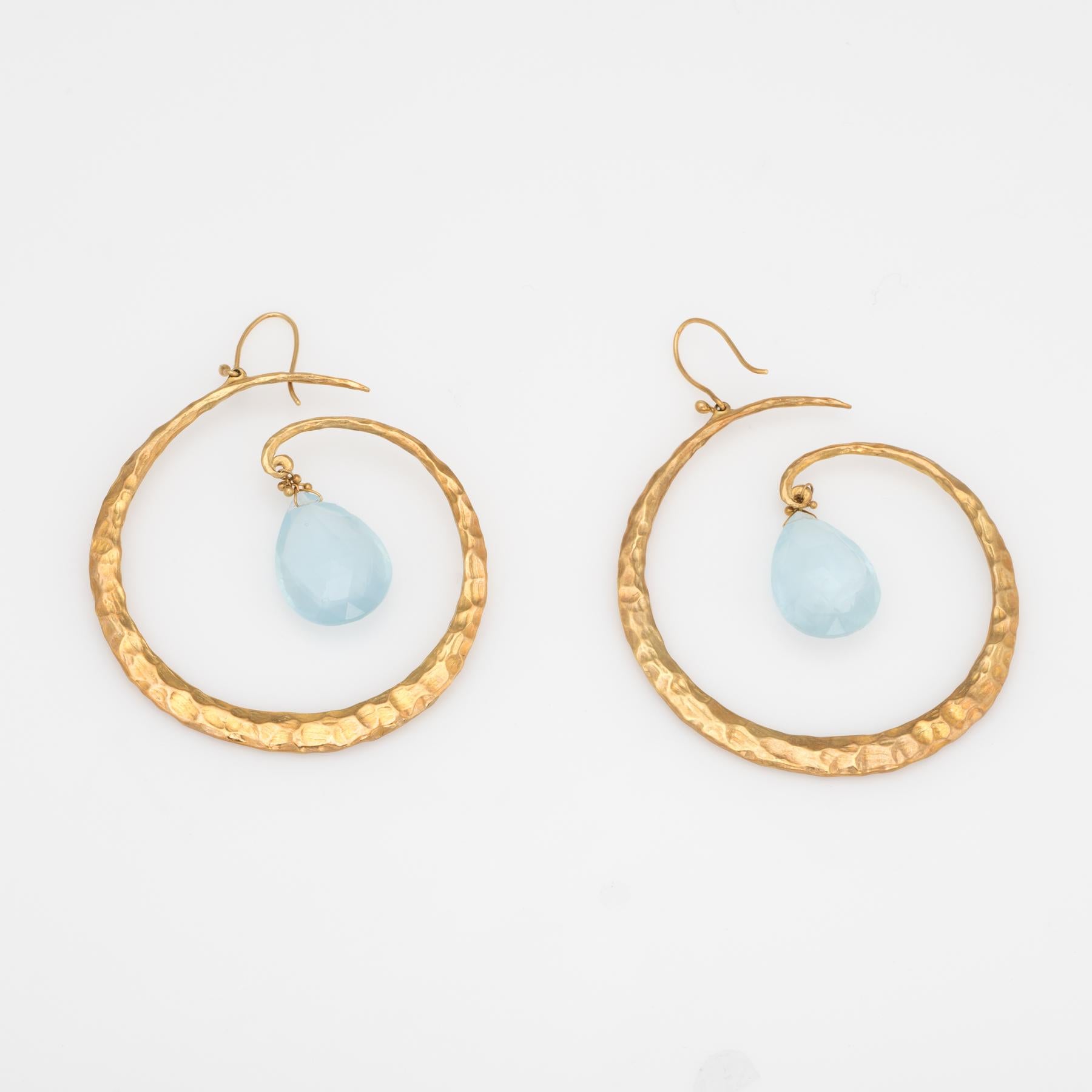 Elegant pair of estate aquamarine large hoop earrings, crafted in 18k yellow gold. 

Briolette faceted aquamarine each measures 16mm x 12mm (estimated at 6.50 carats each - 13 carats total estimated weight). The aquamarines are in excellent