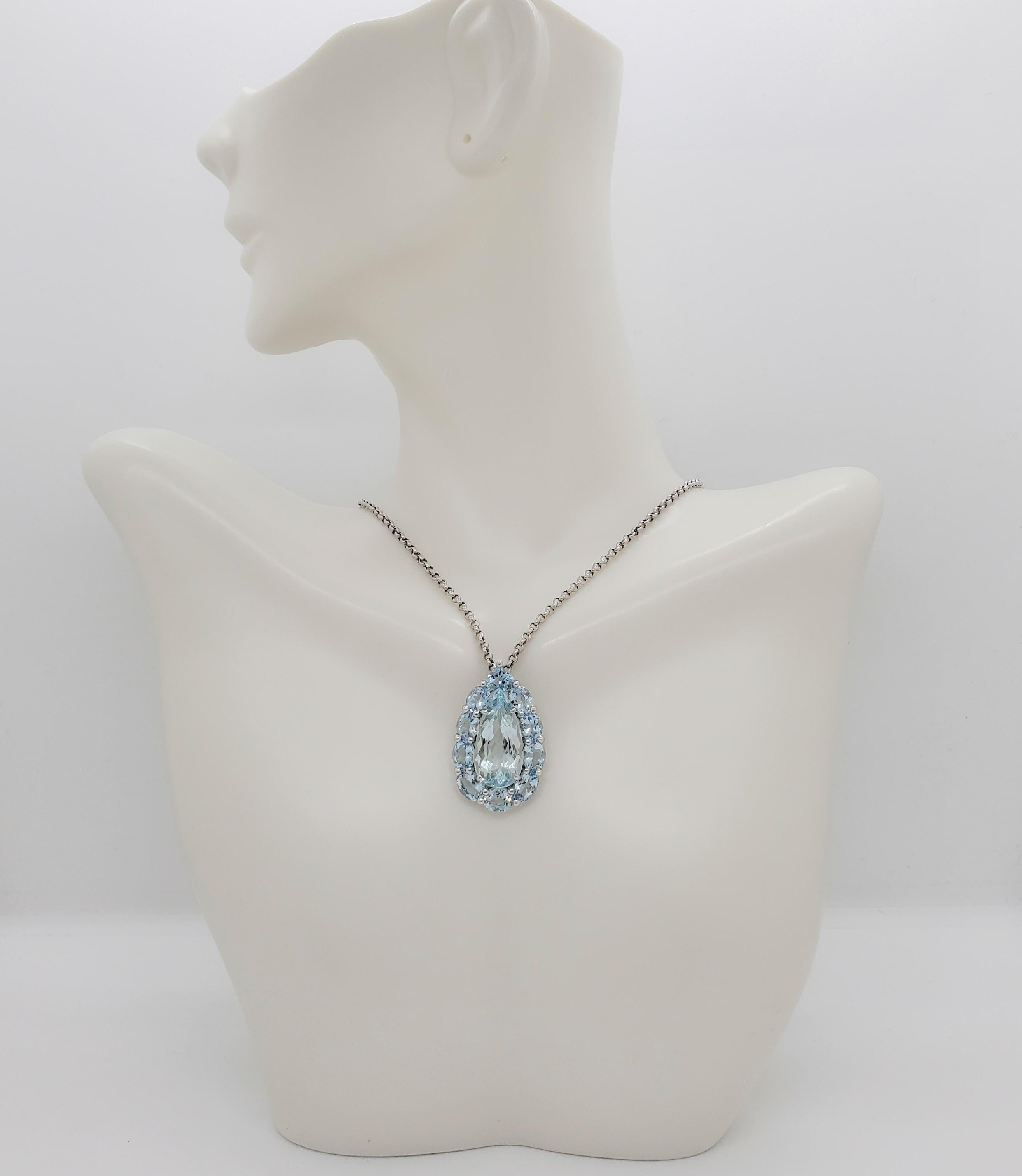 Beautiful 14.00 ct. of aquamarine pears and ovals in a pear shape design.  Handmade in 18k white gold.  Chain is 17.5