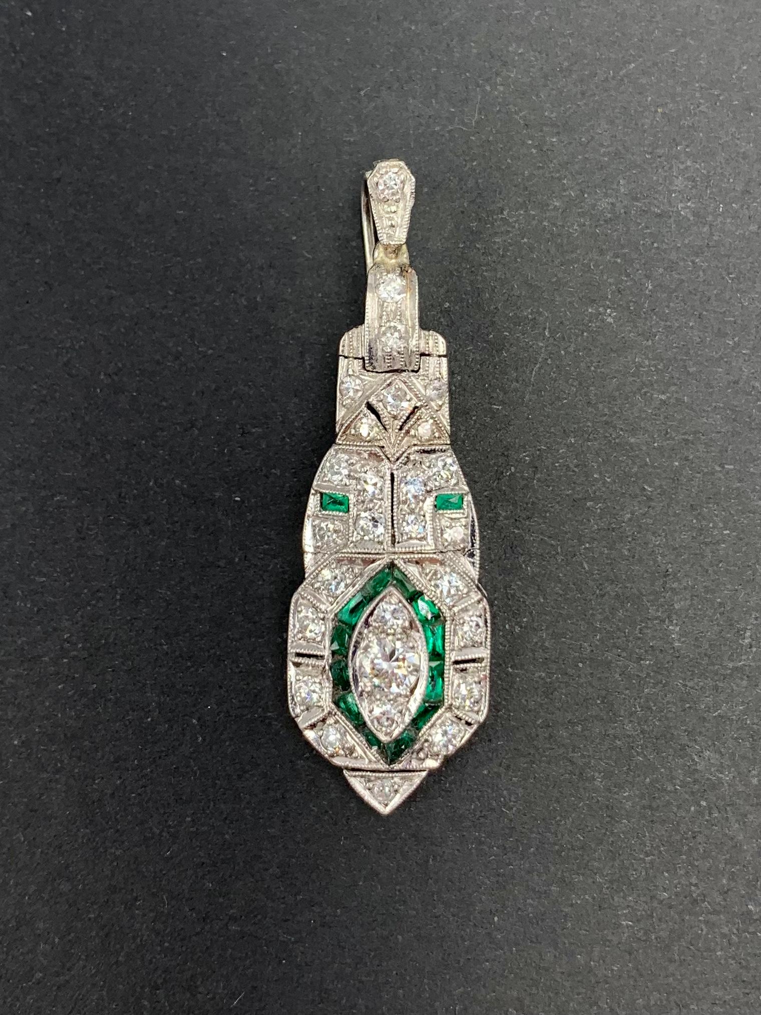 Estate Art Deco Articulated Platinum Diamond Emerald Eye Form Pendant In Good Condition For Sale In New York, NY